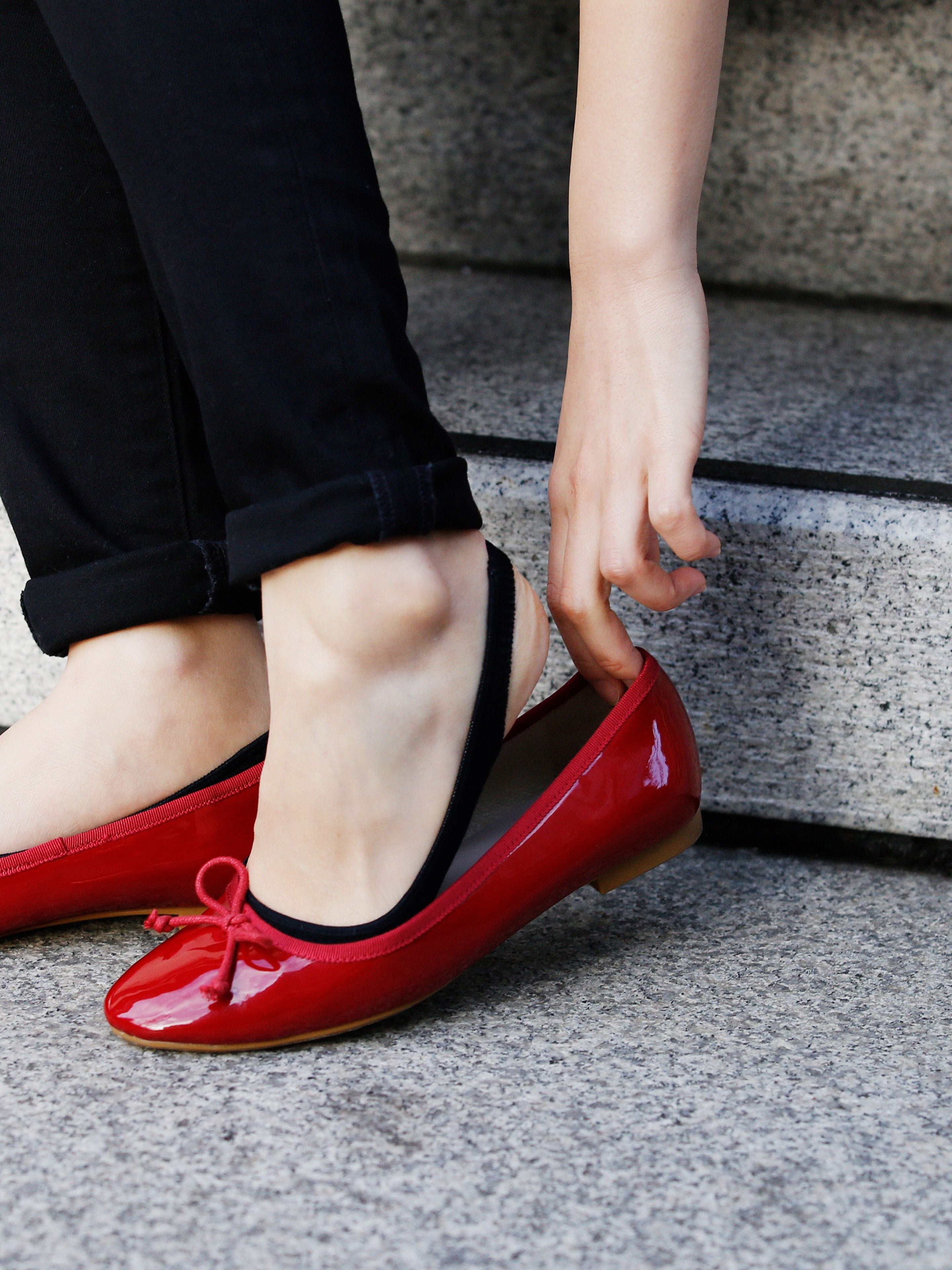 **Alt text:** Tabio Backstrap Sockettes worn with red flats, showcasing a side view and stylish black back strap detail.