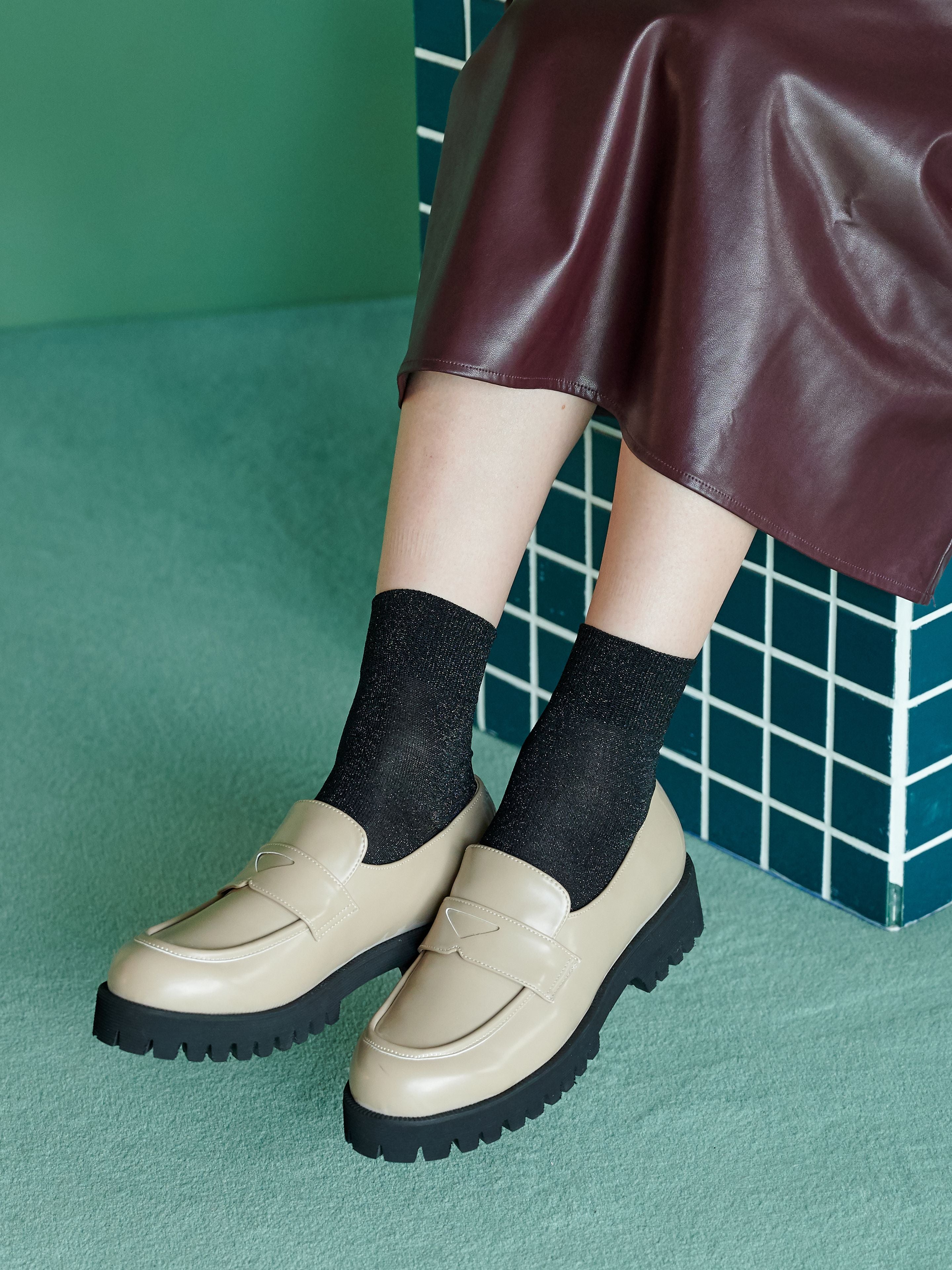 Tabio Sparkly Ankle Socks in black, showcased on model with stylish loafers and a leather skirt, adding elegance and shine.