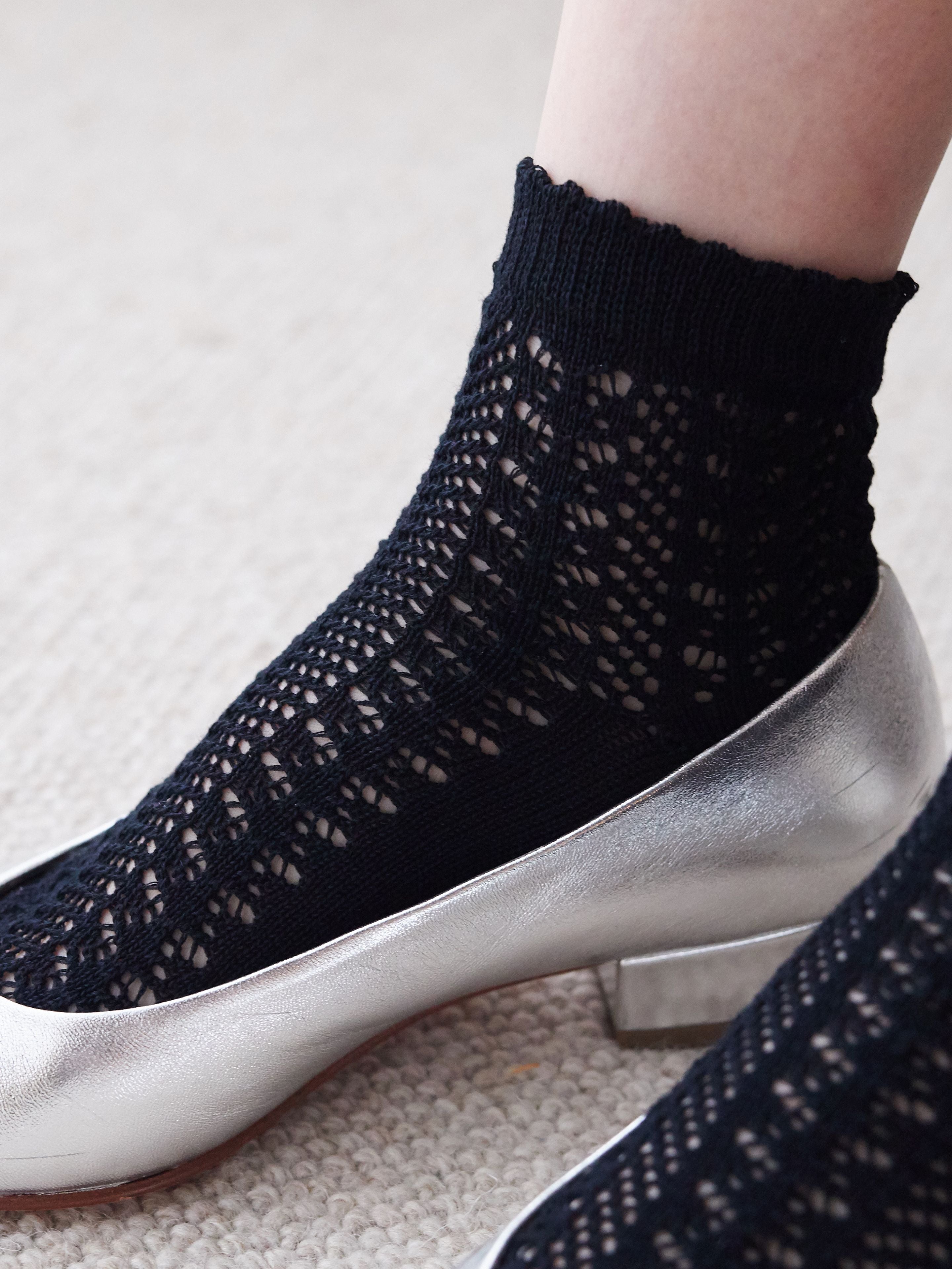 Tabio Irmack Mesh Ankle Socks showcased with a delicate lace pattern, ideal for adding a feminine touch to outfits. Color.