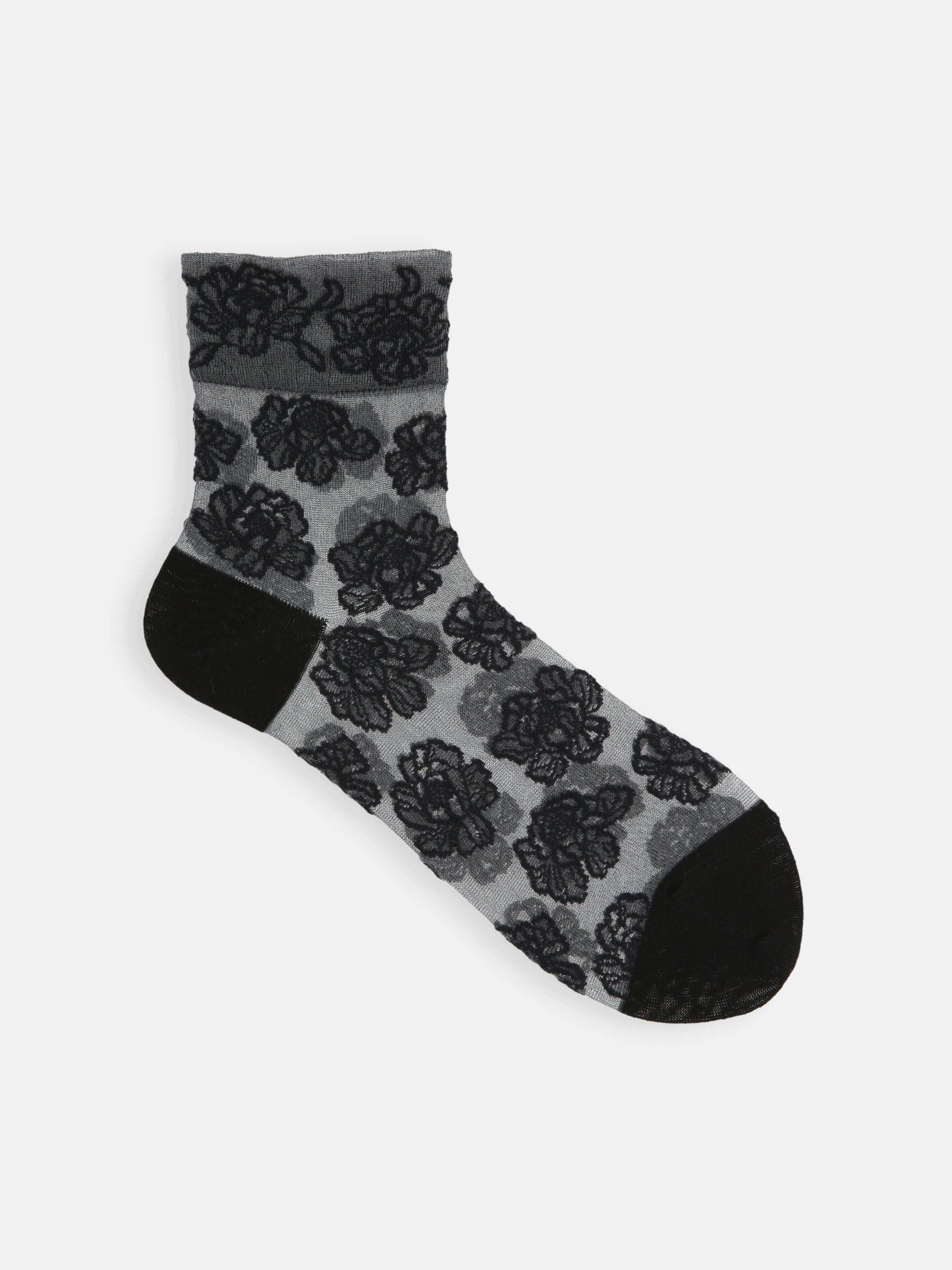 Tabio Tulle Peony Low Crew Socks in black and white, showcasing line-drawn peony pattern and soft elastic detail.