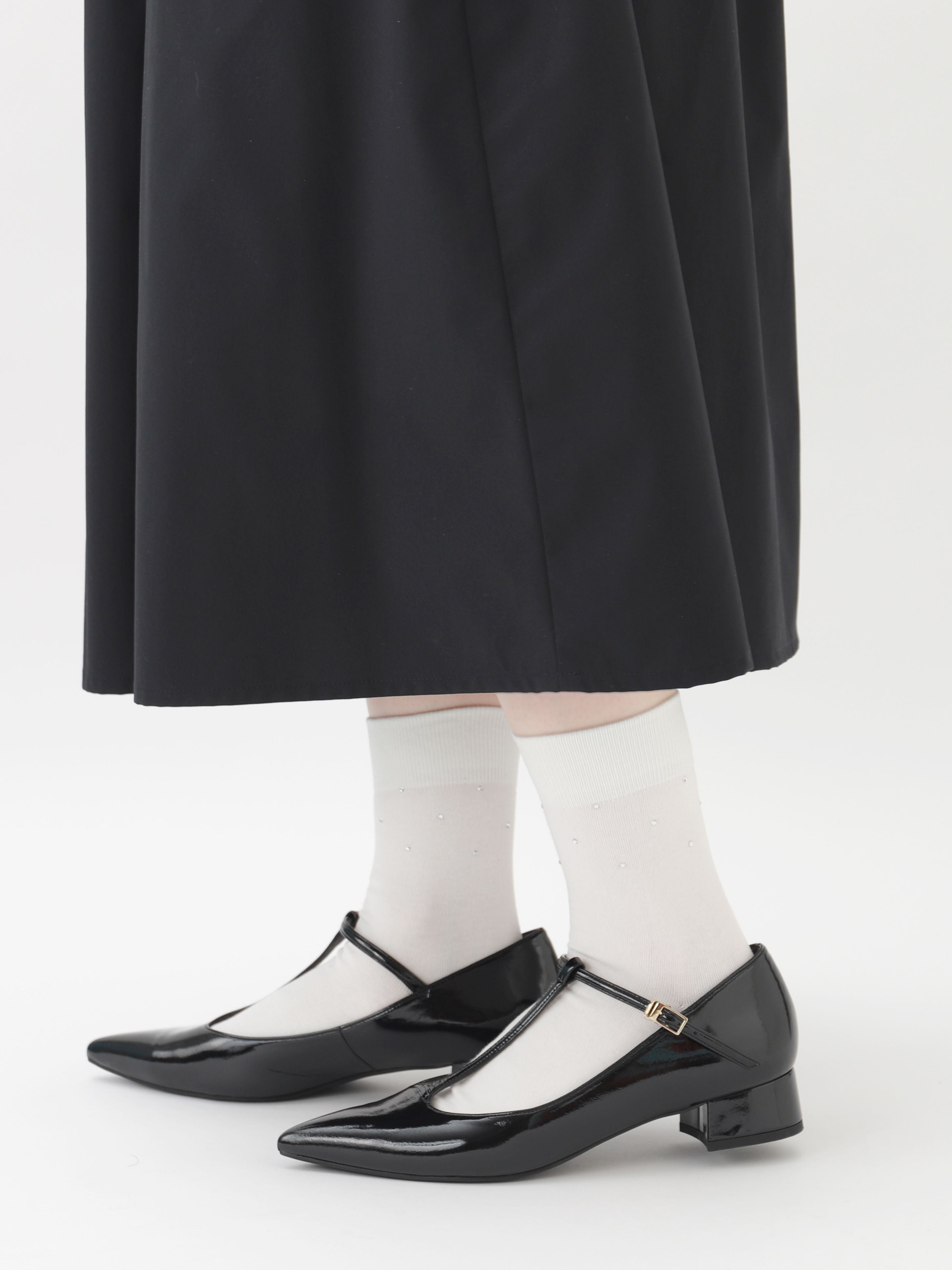 Tabio. Jewel-adorned Socks in white with rhinestones, showcased with stylish black heels for a refined, feminine touch.