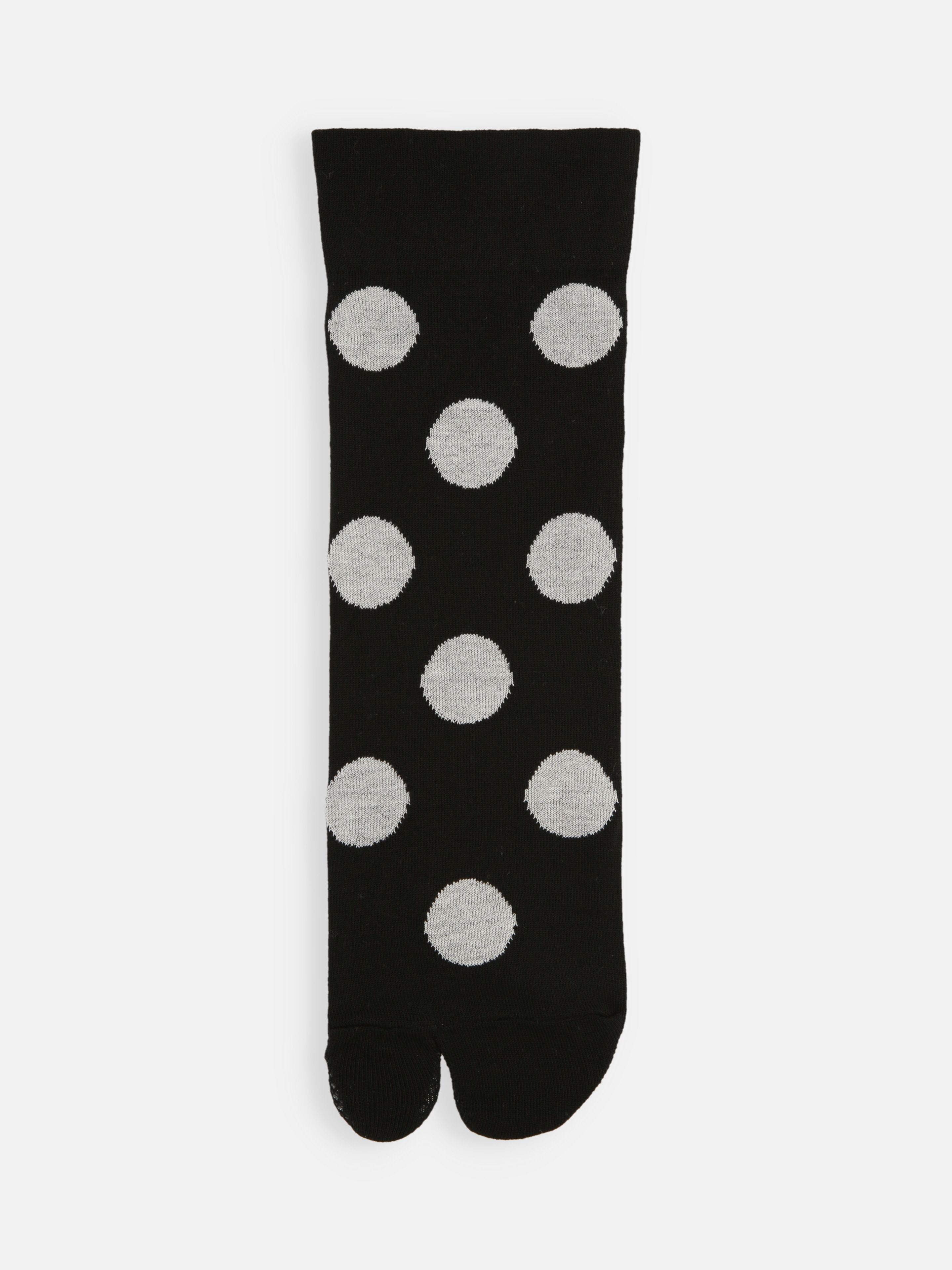 Tabio Big Dots Tabi Socks, showcasing a front view with bold grey dots against a black background, ideal for stylish layering.