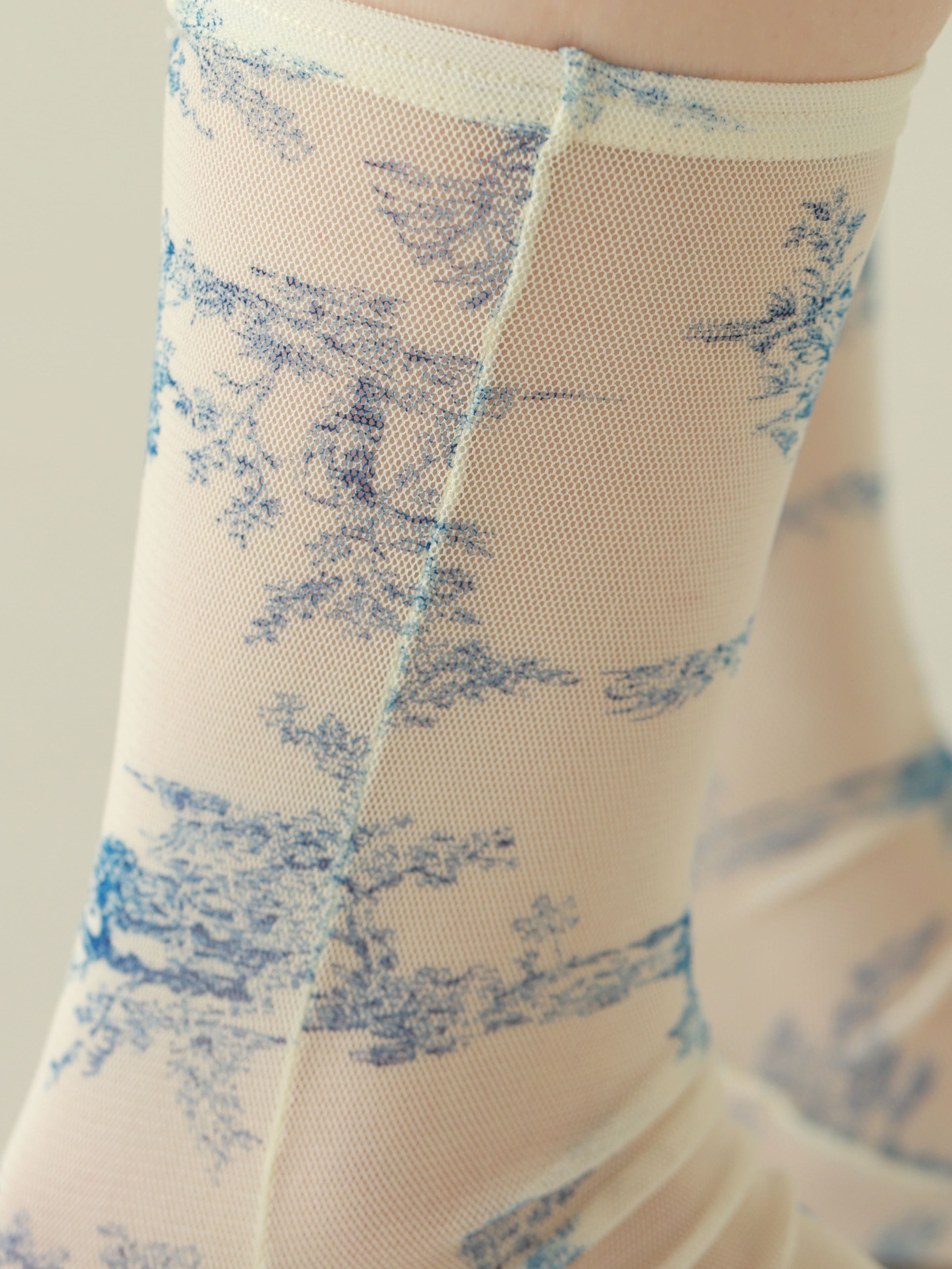 Tabio Sheer Toile De Jouy Crew Socks featuring delicate blue toile print on soft tulle, close-up view highlighting texture.