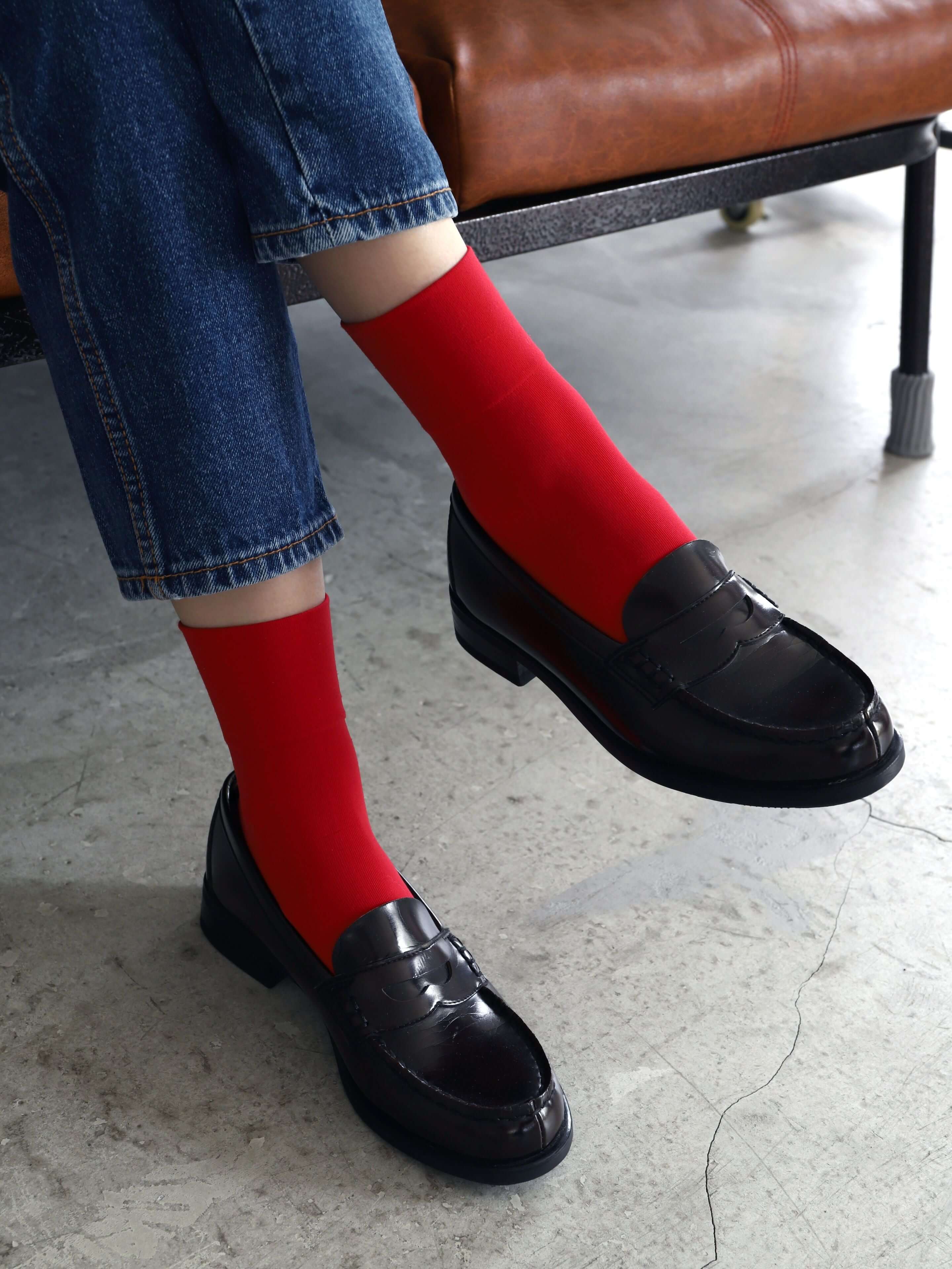 Tabio Soft Nylon Socks in vibrant red, showcasing a close-up on model wearing with black loafers and denim. Soft and.