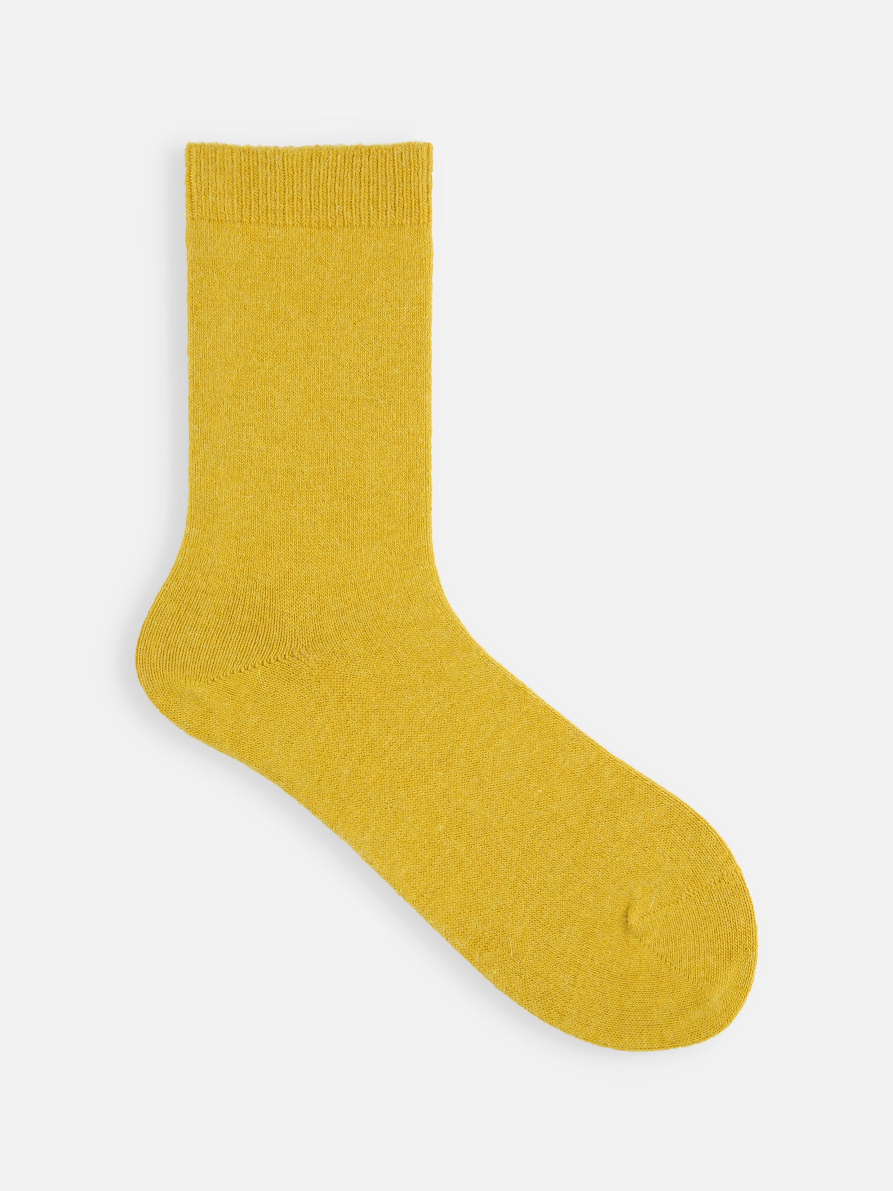 Tabio Soft Fit Angora Plain Sock in mustard, showcasing a close-up of the luxurious angora-blend fabric.
