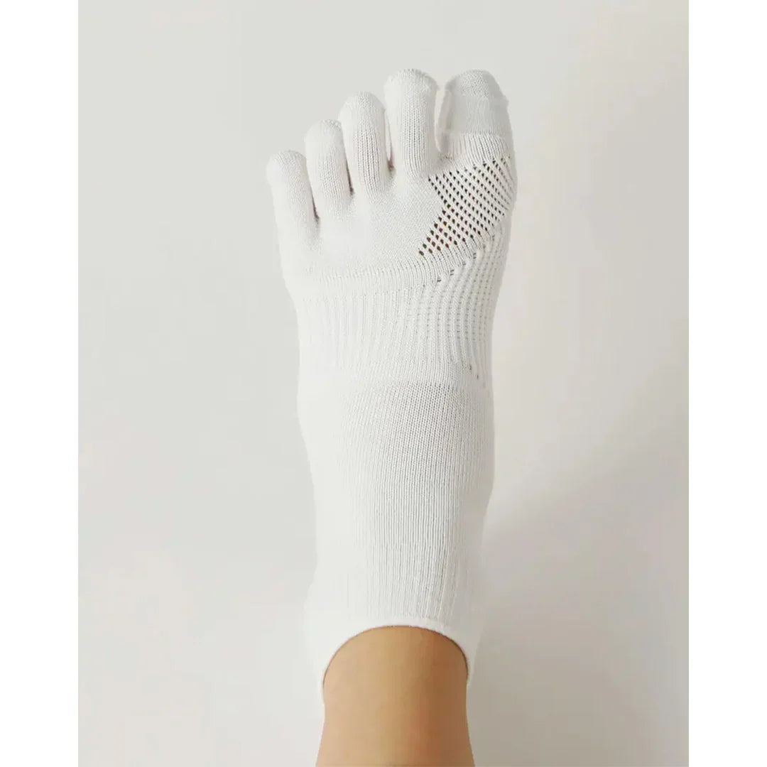 Tabio. Toe Socks For Hallux Valgus showcasing a close-up of white socks with individual toe slots for comfort and support.