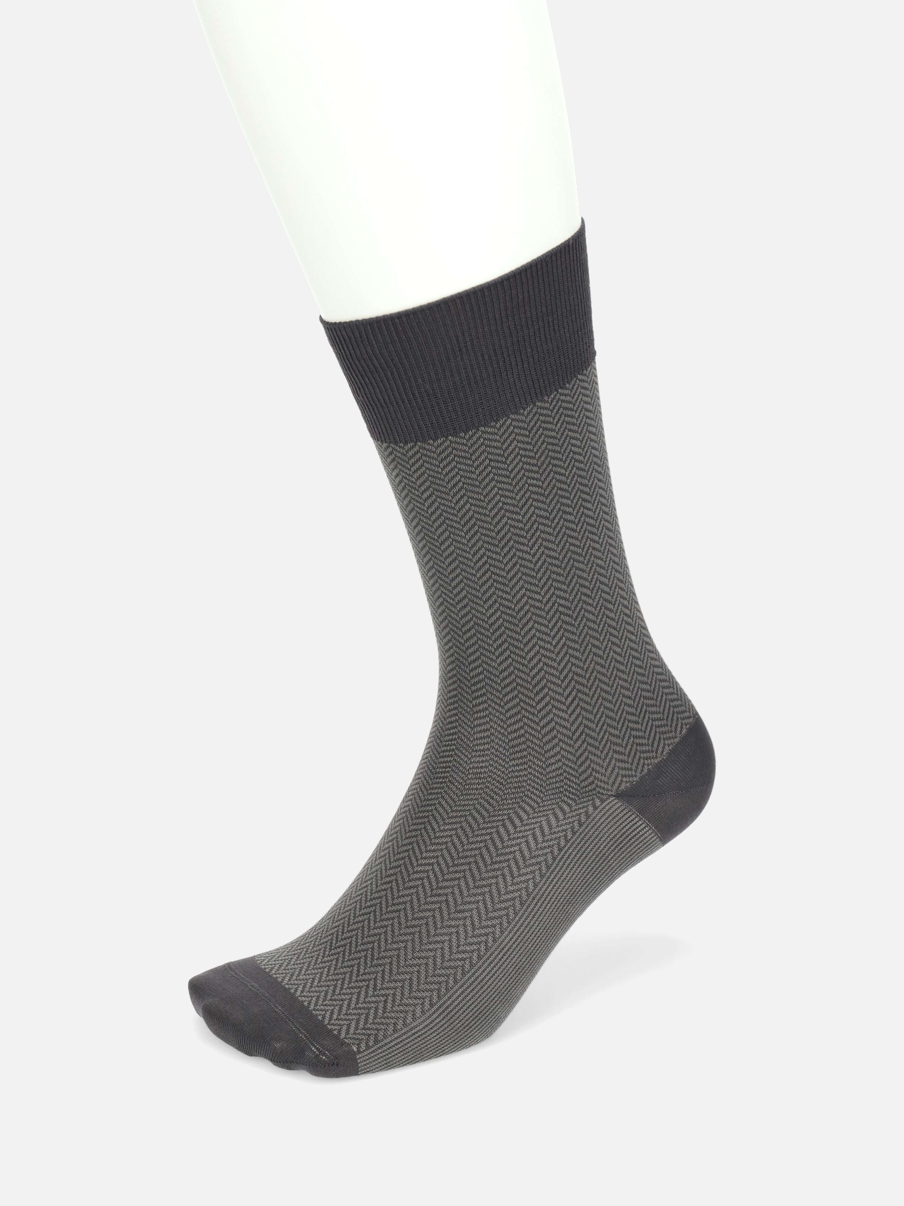 Tabio Herringbone Finest Supima Mid-Calf Socks in black and grey showcase a jacquard pattern, perfect for formal attire.