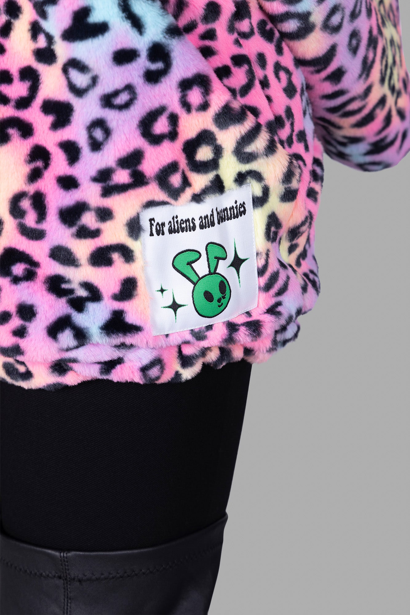 Natasha Zinko Soft Leopard-print Jacket detail showing colorful leopard pattern and logo label on the hem.