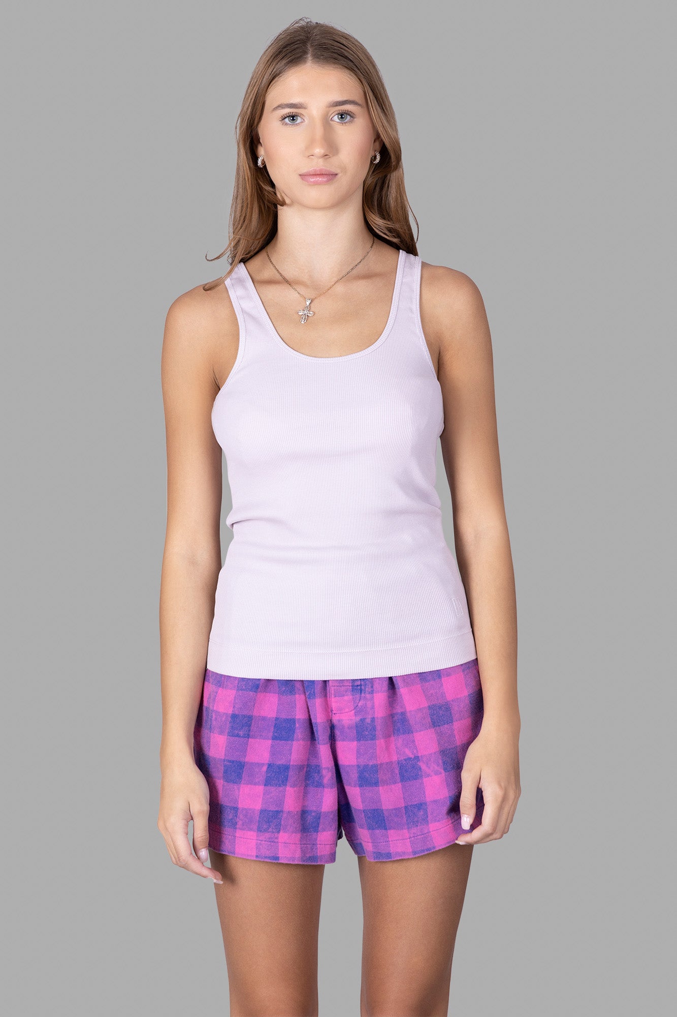 By Malene Birger Lilac Tank Top on model, showcasing the soft ribbed texture and slim fit in a light lilac color.