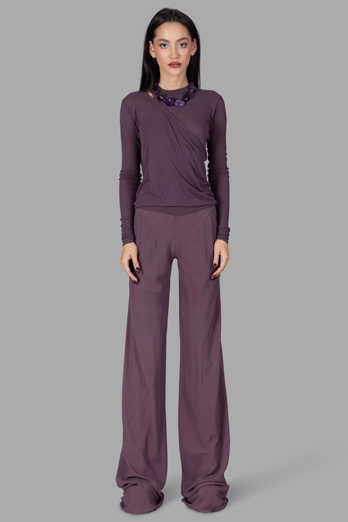 Rick Owens Silk Bias-cut Trousers, mauve, on model; full-length view showing loose fit and raw hems with ribbed waistband.