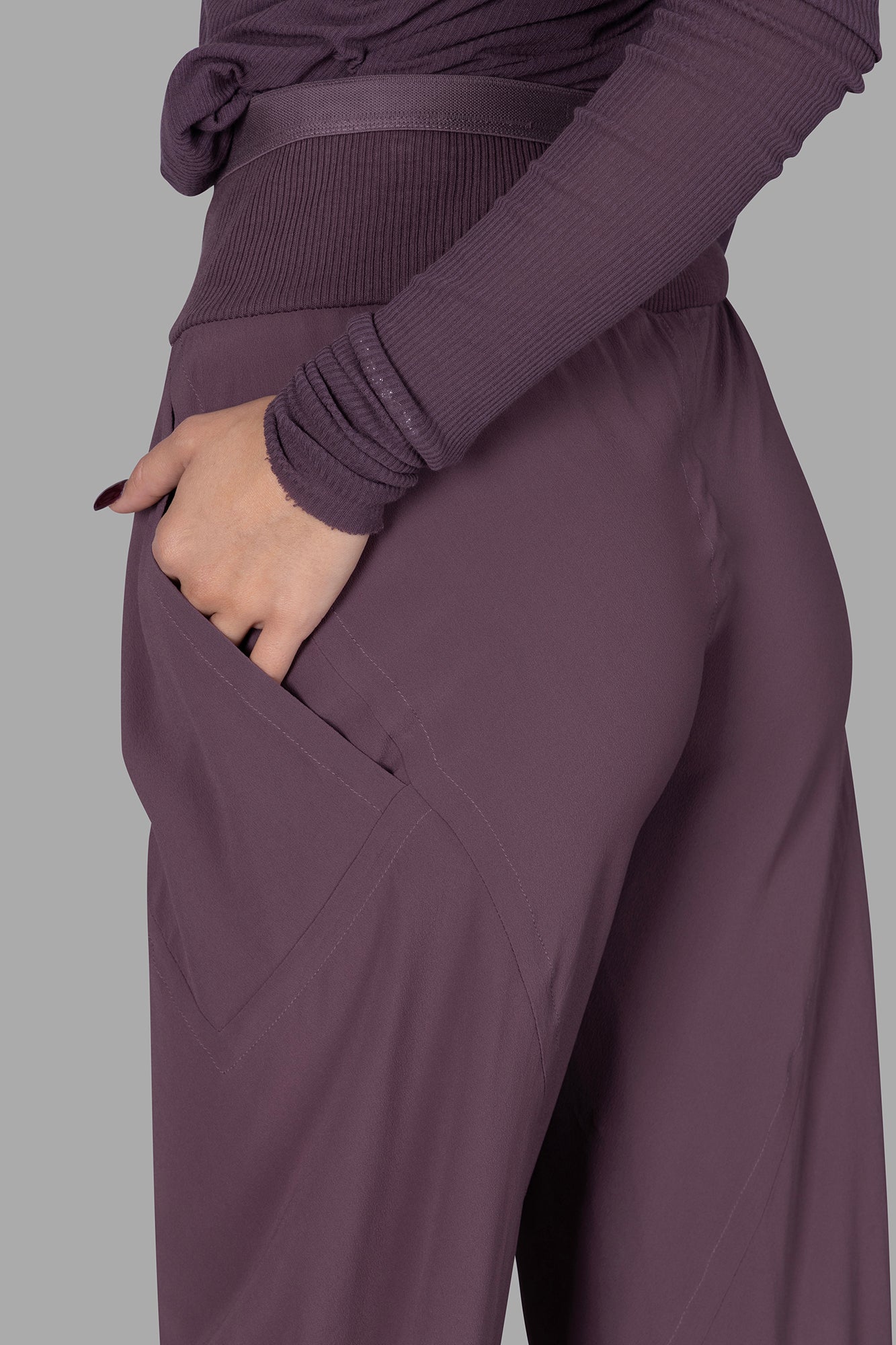 Rick Owens Silk Bias-cut Trousers feature a ribbed waistband and loose fit, shown here highlighting side pocket detail.