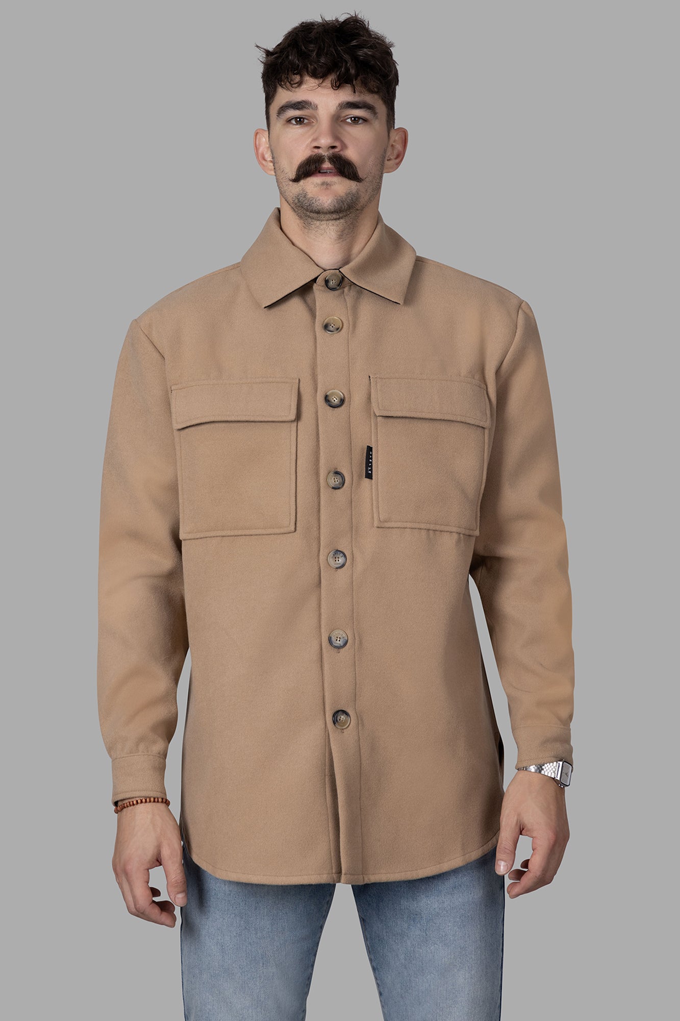 Gaëlle Paris Beige Shirt Jacket, front view on model, featuring dual chest pockets and button detail. Ideal for casual styling.