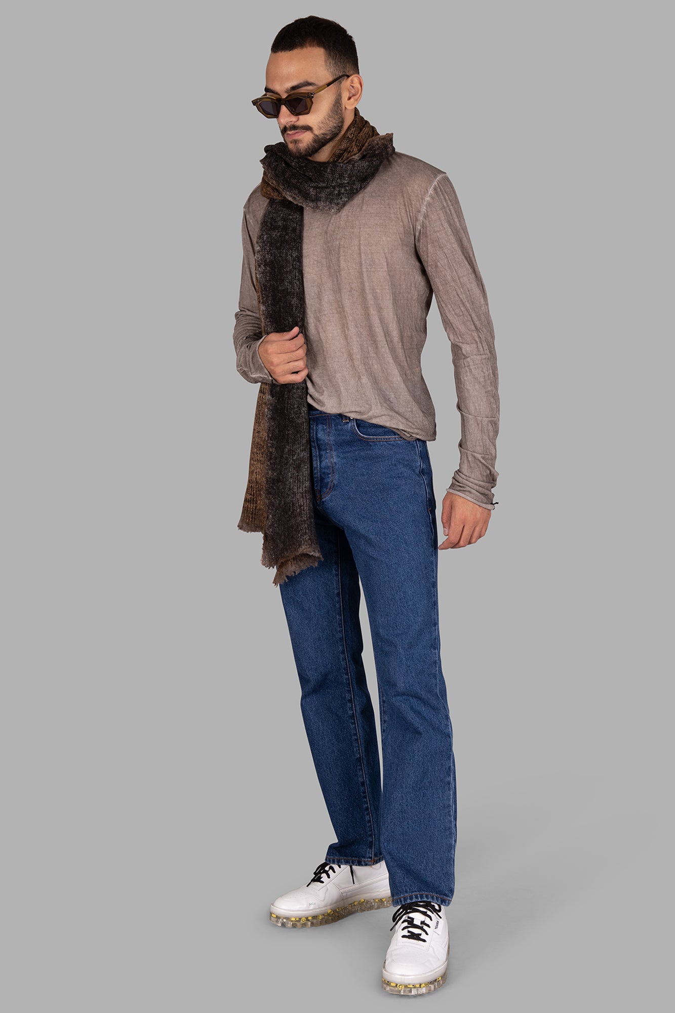 MD 75 beige lightweight cotton blouse with round neckline and long sleeves, modeled with scarf and jeans.