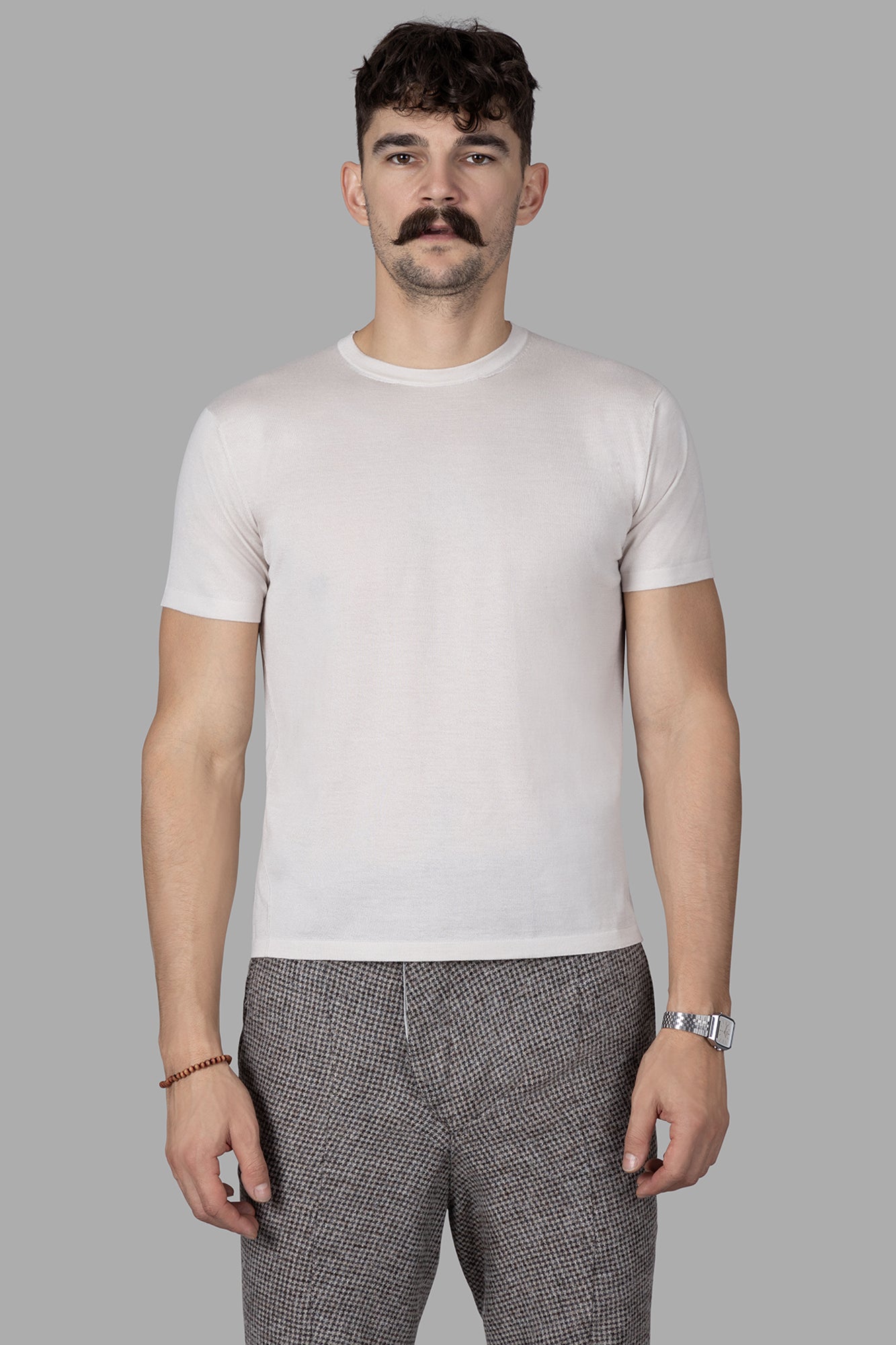 AION Fine-knit T-shirt in cream, featuring a slim fit design with a rounded neckline and short sleeves.