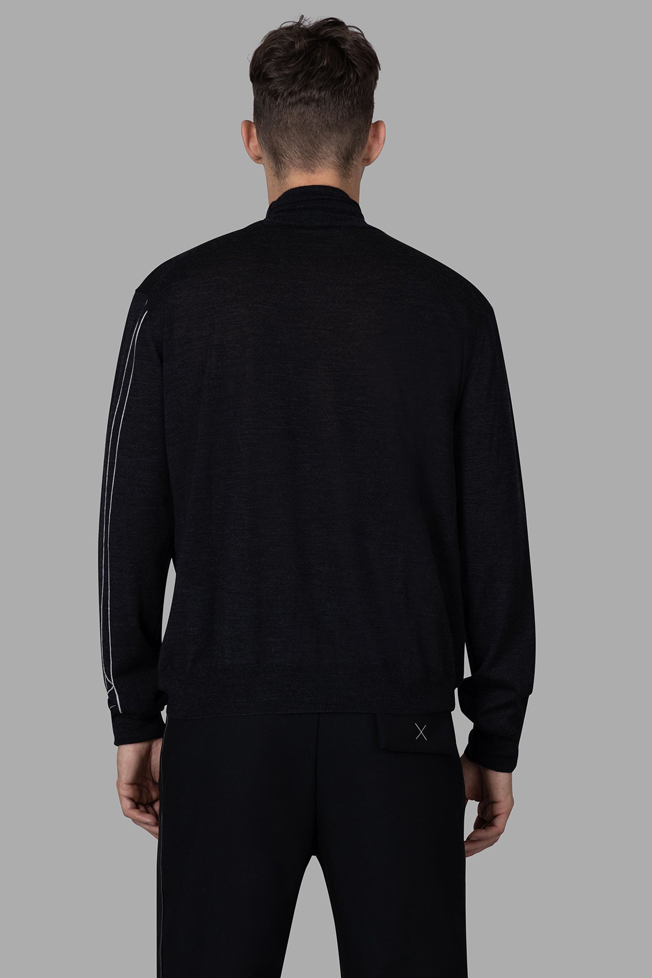 AION Fine-knit Turtleneck Sweater shown from the back, crafted from luxurious wool in antracite color for a warm fit.