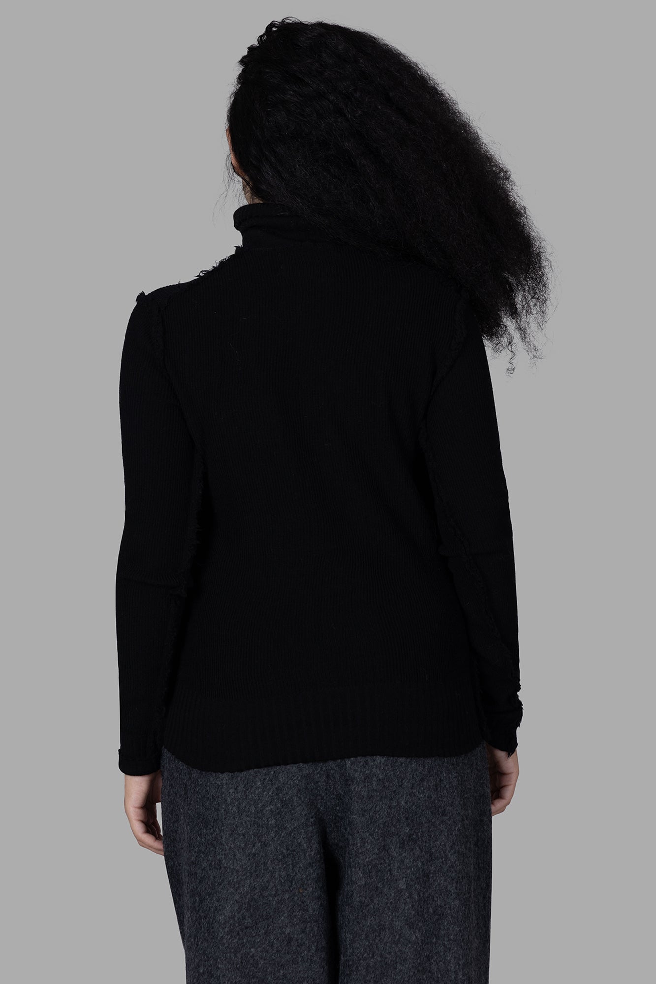 Marc Point Roll-neck Sweater, black, shown from the back, featuring cozy 100% Merinos wool fabric. Ideal for chilly days.