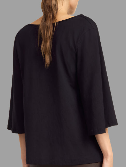 By Malene Birger Bryar Cotton T-shirt, back view on model showcasing relaxed fit and wide sleeves in black cotton fabric.
