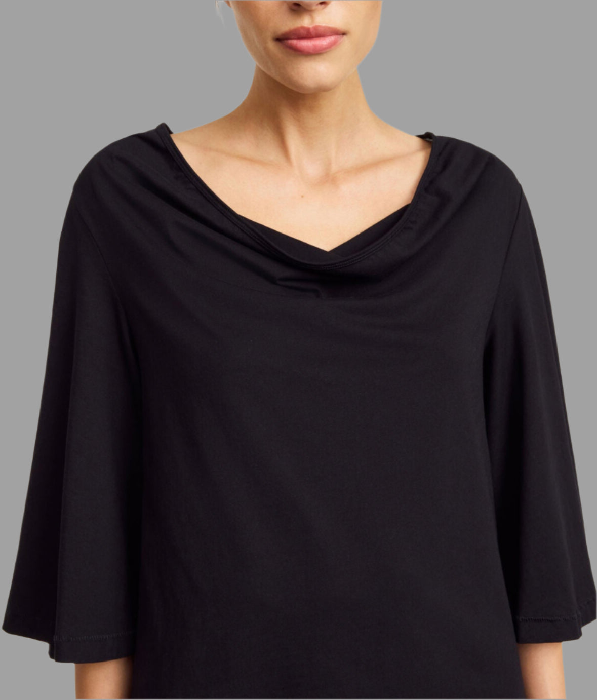 By Malene Birger Bryar Cotton T-shirt, featuring a stylish draped neckline and 3/4 sleeves on a model's upper body.
