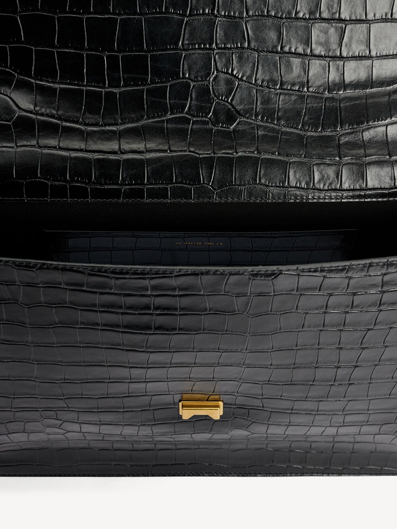 By Malene Birger Ronlas Leather Shoulder Bag showing the croco-embossed texture and gold clasp detail on the front.