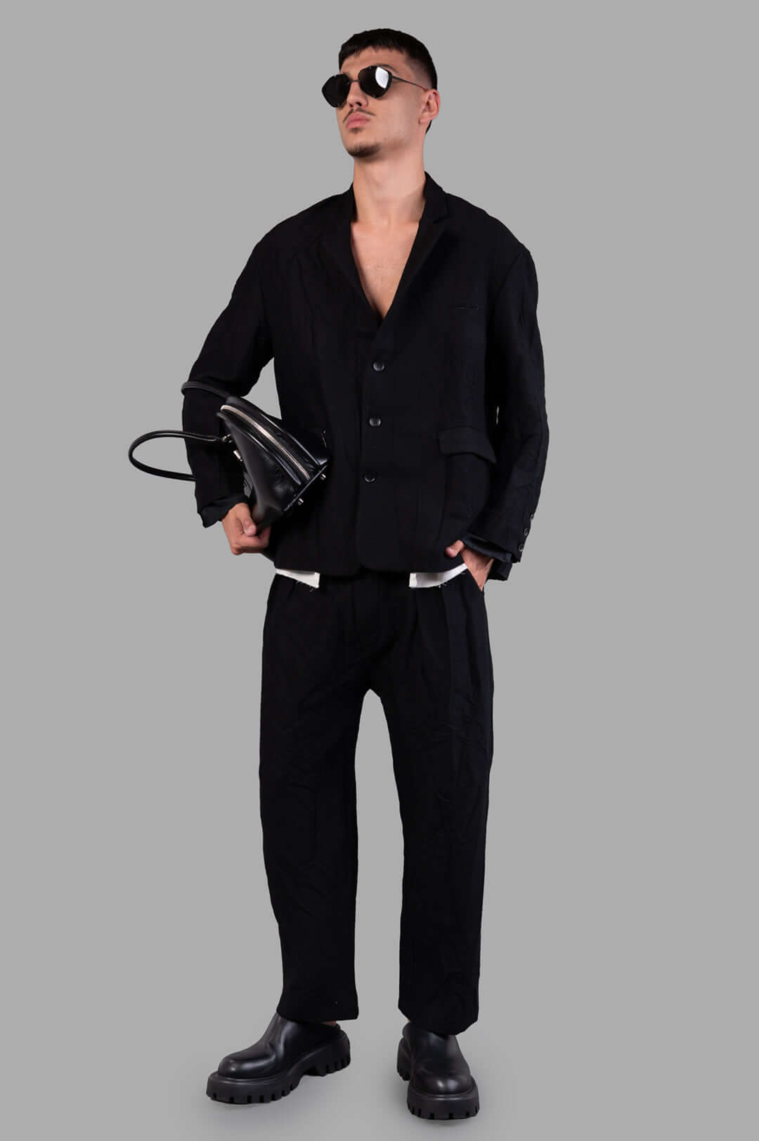 Marc Point Single-breasted Blazer in black wool, front view on model, showcasing layered texture and sleek silhouette.