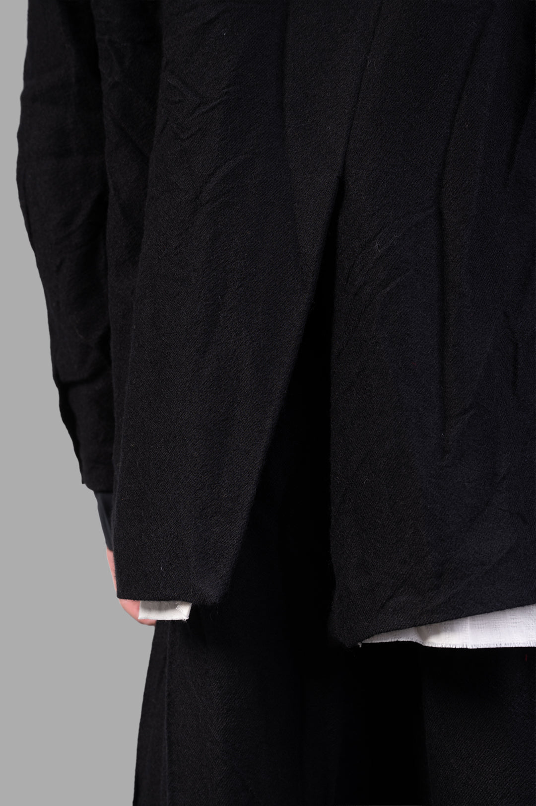 Marc Point Single-breasted Blazer close-up of black wool fabric showcasing the unique layering and texture details.