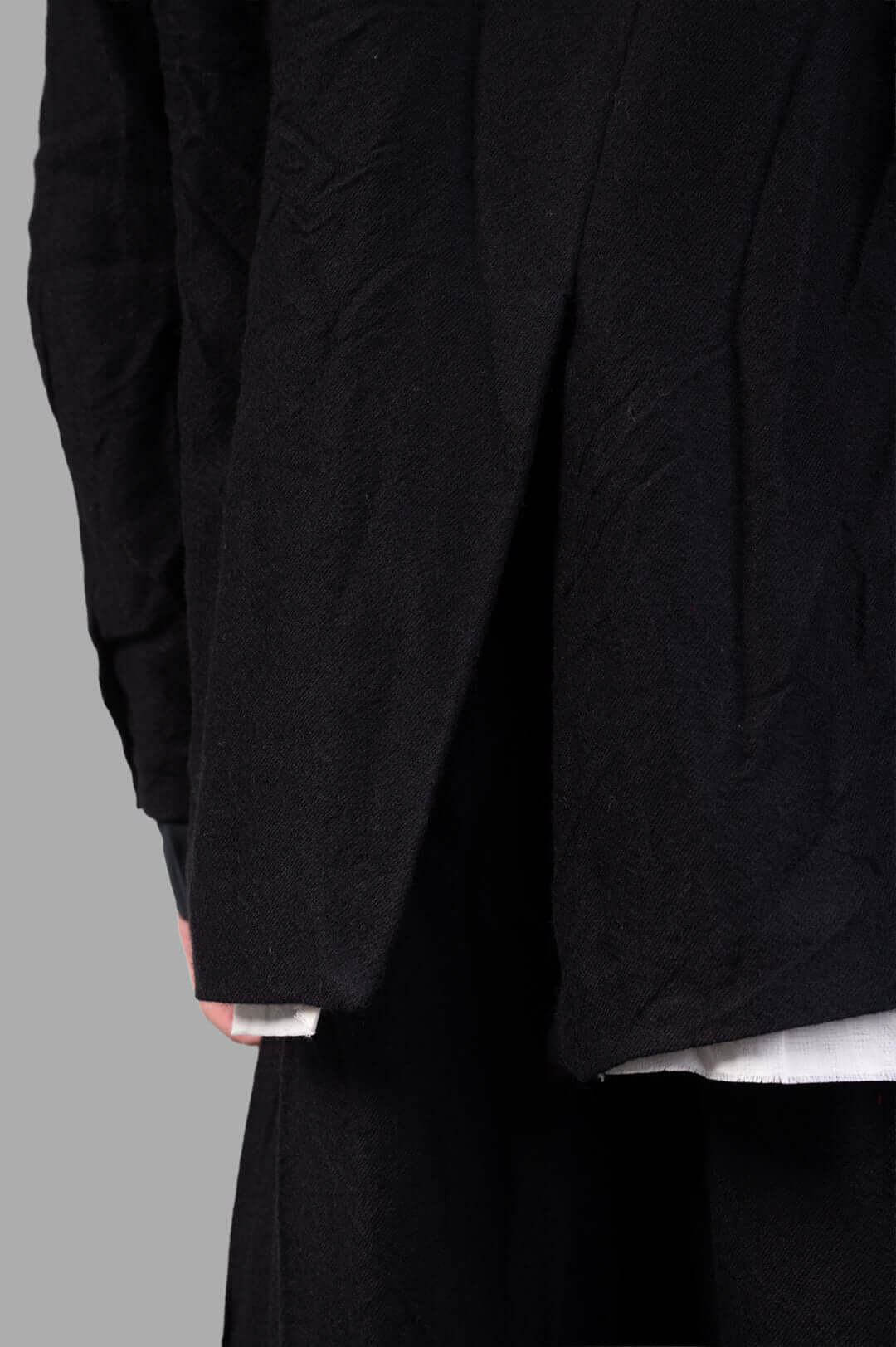 Marc Point Single-breasted Blazer close-up of black wool fabric showcasing the unique layering and texture details.