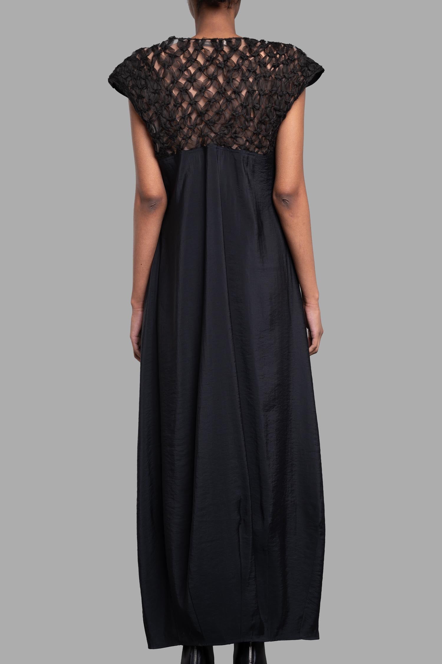 Gentry Portofino Gathered Dress showcasing the back with a delicate see-through floral panel and cap sleeves in black.