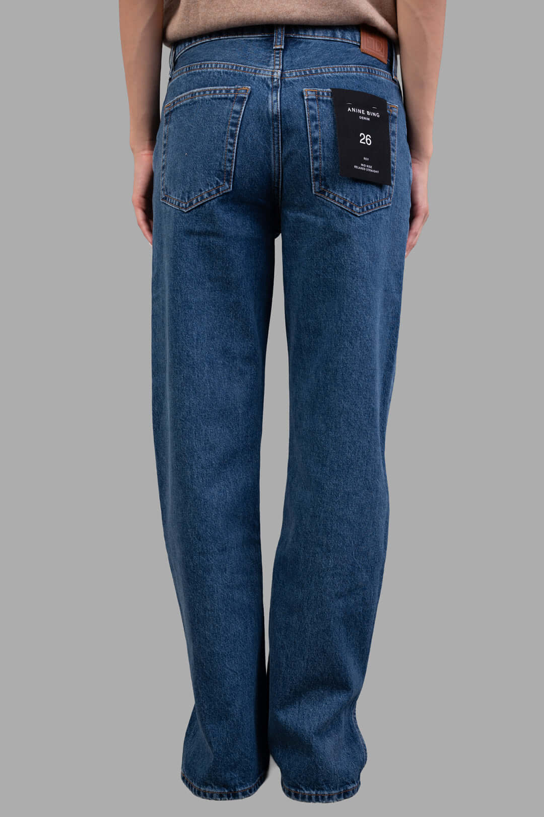 Anine Bing Roy Jeans featuring a clean blue wash, shown from the back with visible label and midweight cotton texture.