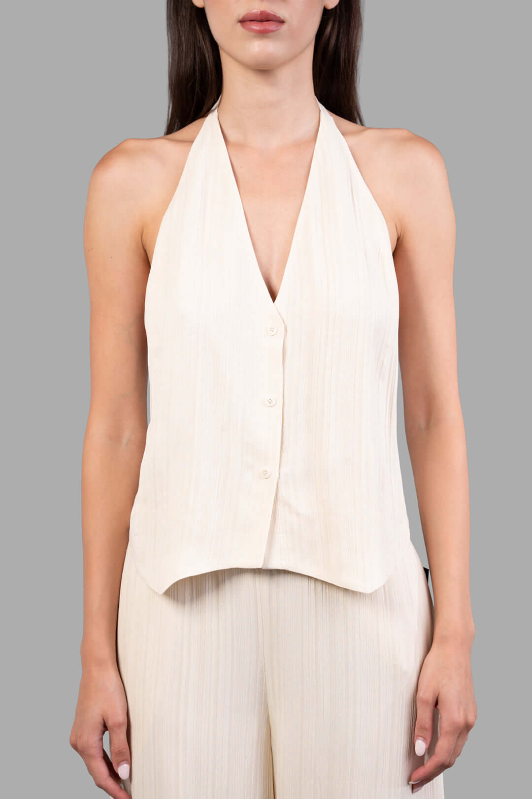 Joseph. Suez Pleat Jacquard Tie Waistcoat shown front view; halter neck style in textured viscose with button details.