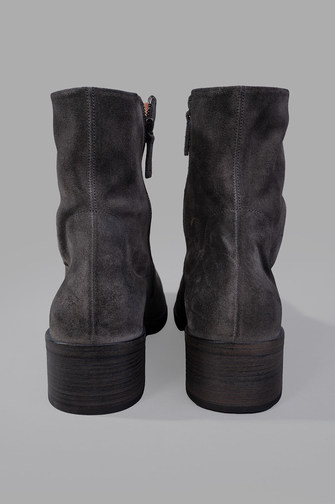 Marsèll Cassello Ankle Boots, showcasing the unique gray leather texture and distinctive contrasting heel from the back.