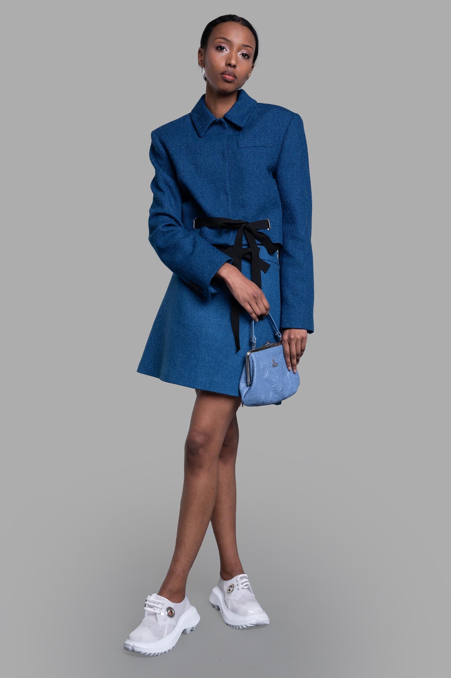 MSGM Cropped Drawstring Blazer in blue with classic collar, drawstring waist detail, and stylish on-model fit.
