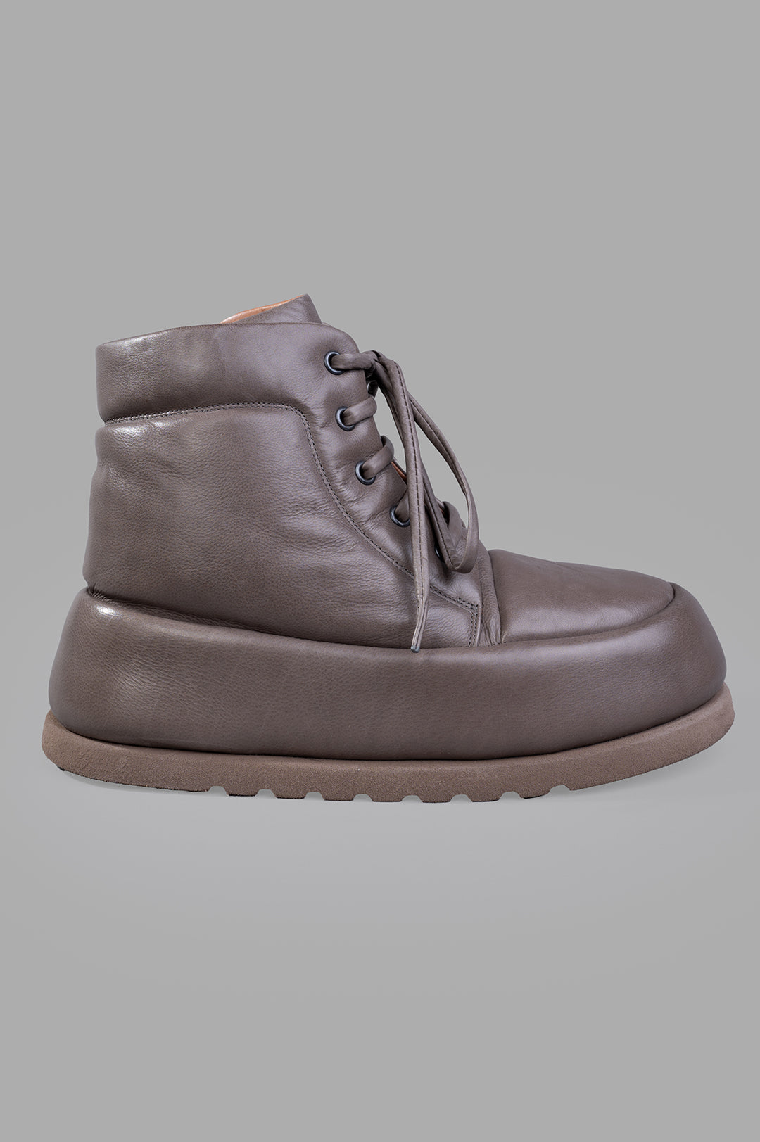 Marsèll Bombo Ankle Boots, side view showcasing sleek leather design and lace-up detail on a grey background.
