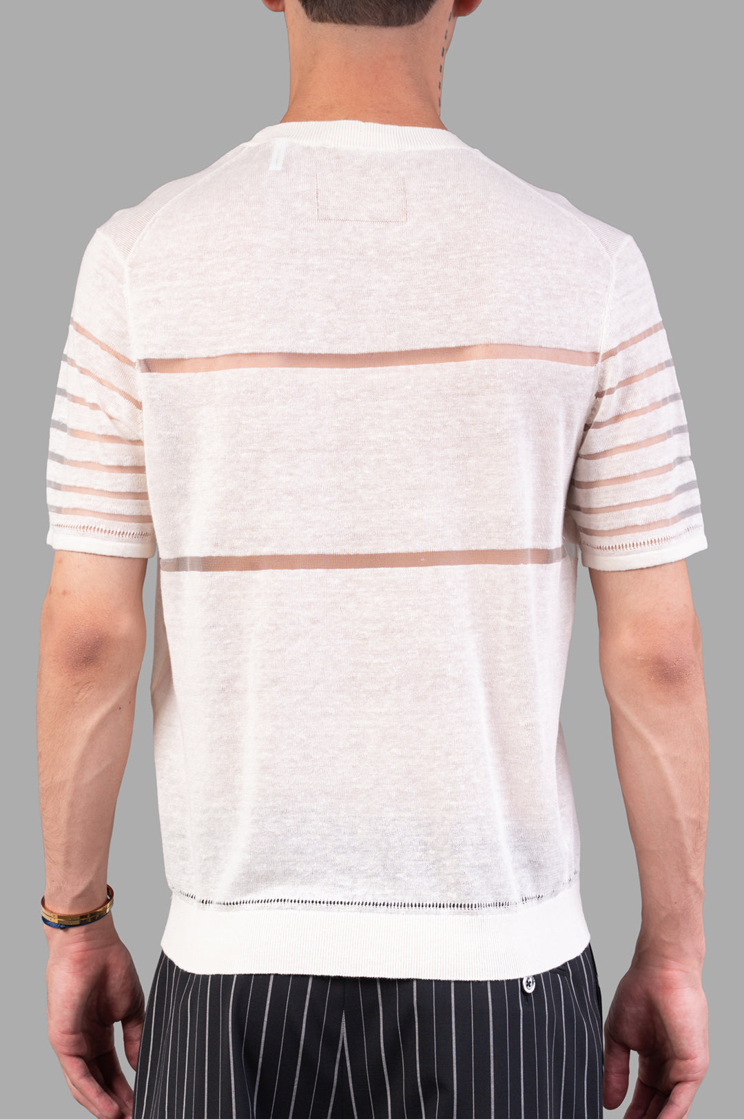Vivienne Westwood. Sheer Stripe Tee in Ivory, showcased from the back, highlighting sheer stripes and lightweight linen.