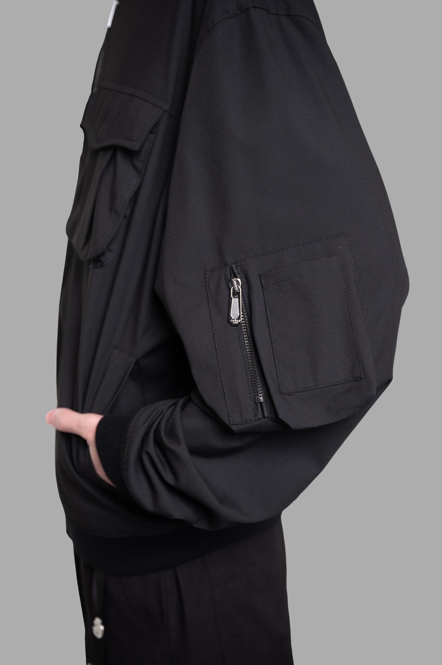 Gaëlle Paris Cargo Jacket features a side view showcasing stylish zippered sleeve pocket and relaxed fit. Perfect for layering.