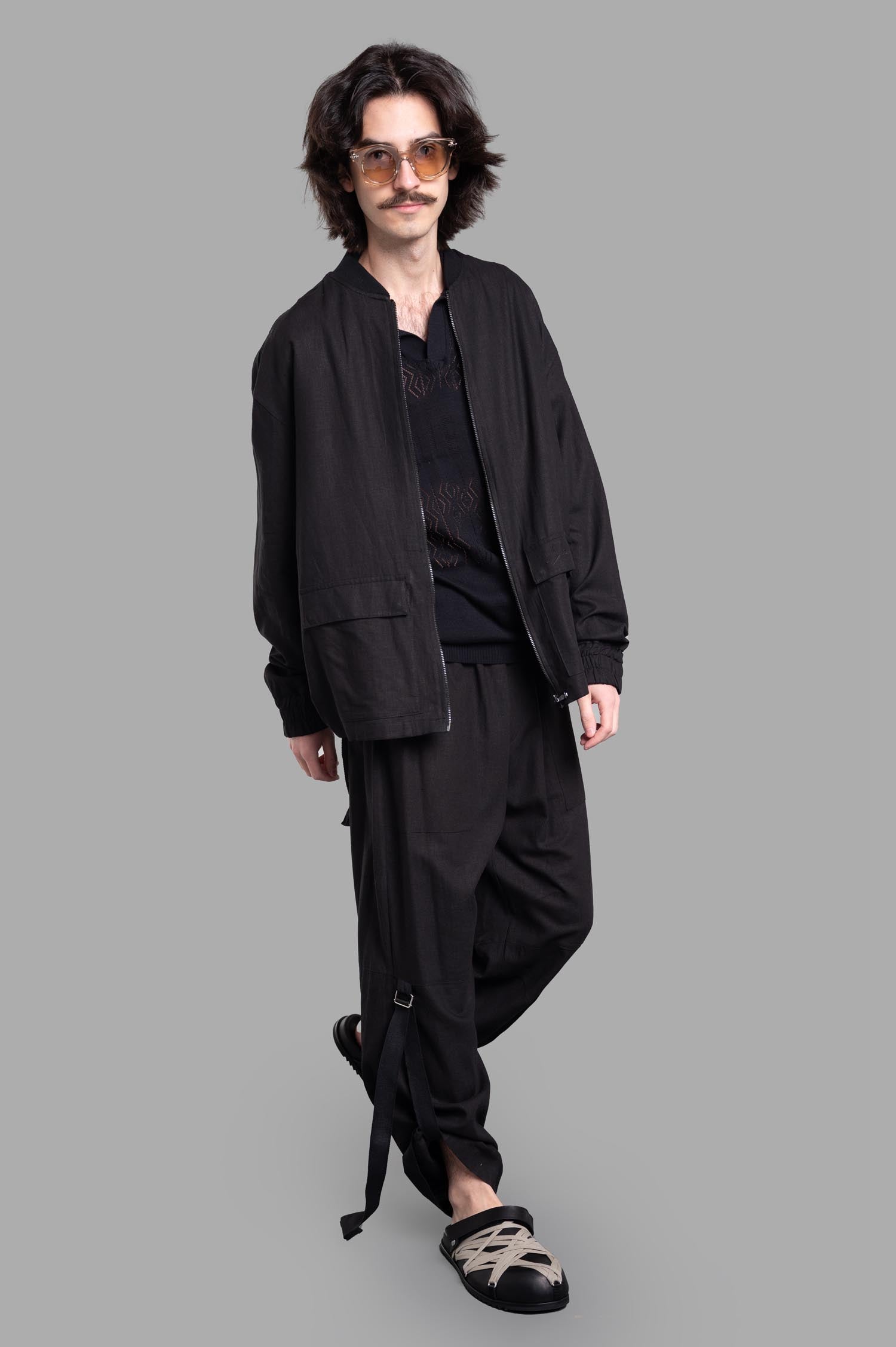 Gaëlle Paris Drawstring Jacket in black, front view on-model, zip-up bomber style.