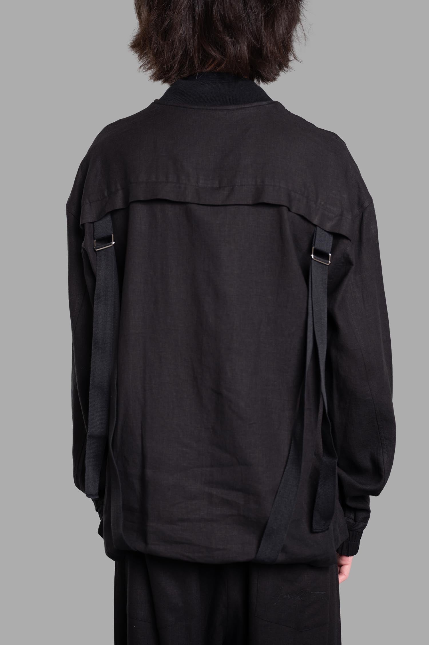 Gaëlle Paris Drawstring Jacket featuring back drawstrings, shown from the back in black linen-viscose blend.