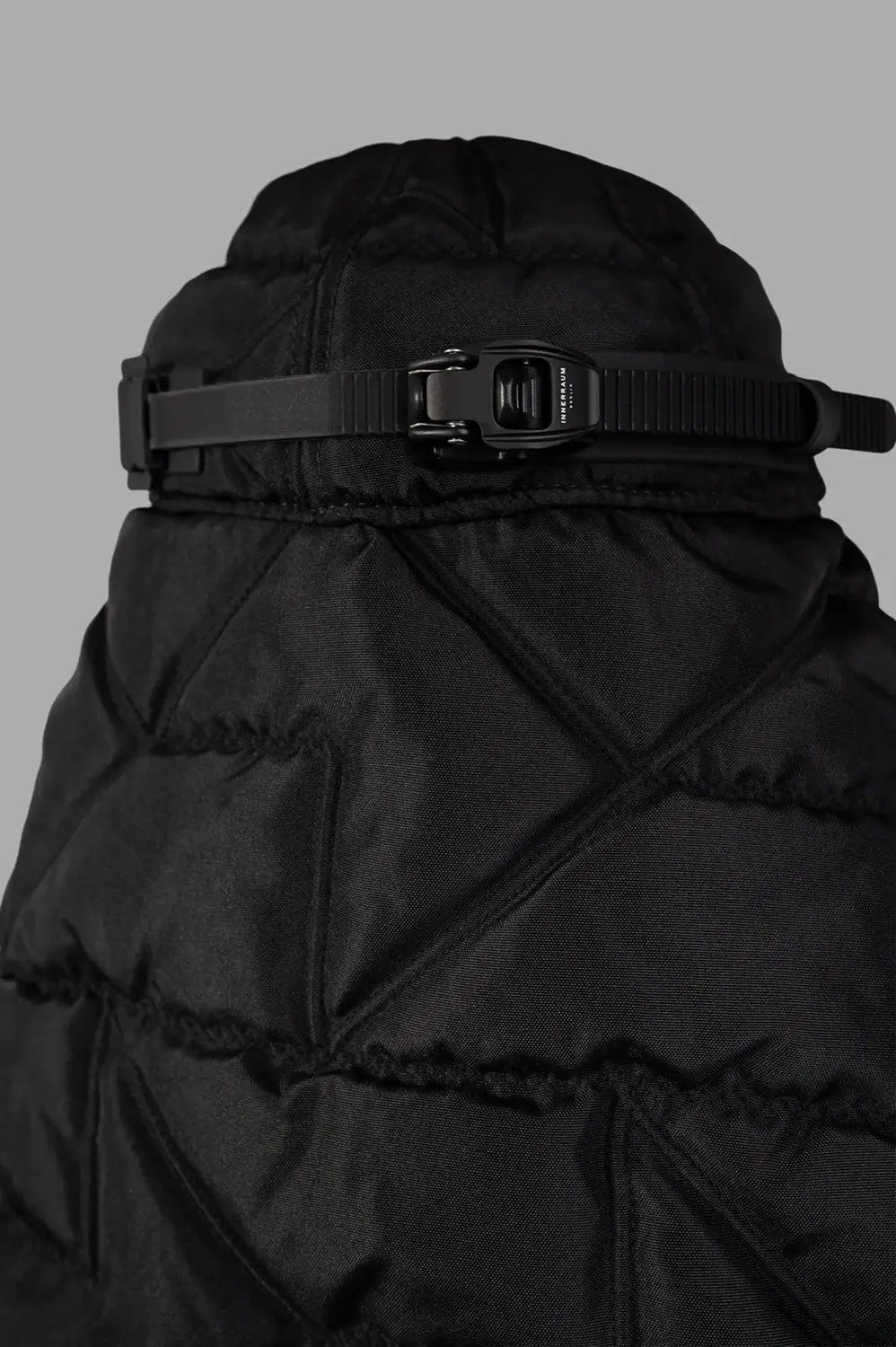 Innerraum Puffer Scarf Cap with Quilted Veil showcasing a close-up of the rear strap and detailed geometric quilting.