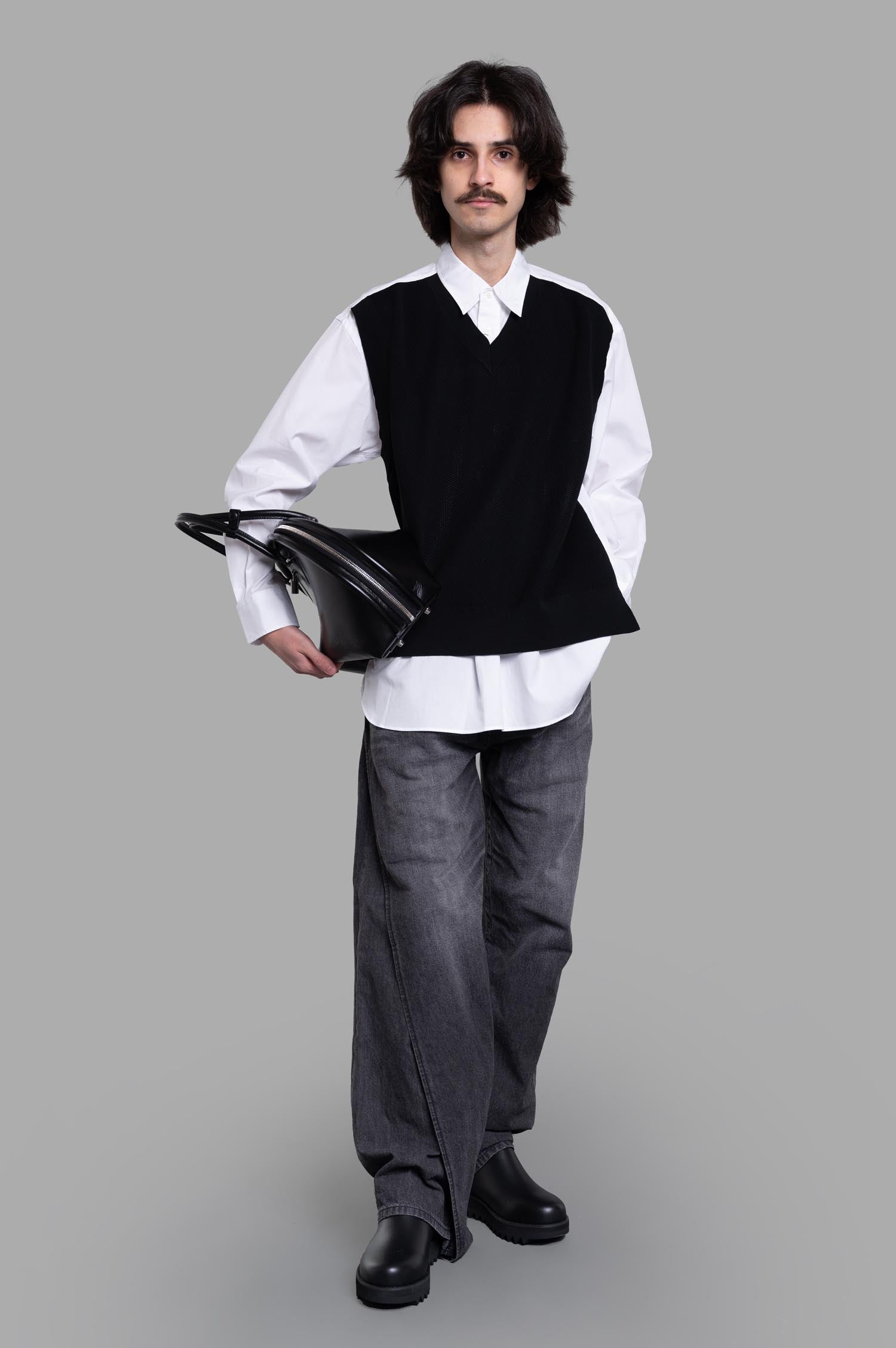 Comme des Garçons Layered Shirt, front view showcasing white shirt with black vest, worn by model, 100% cotton.