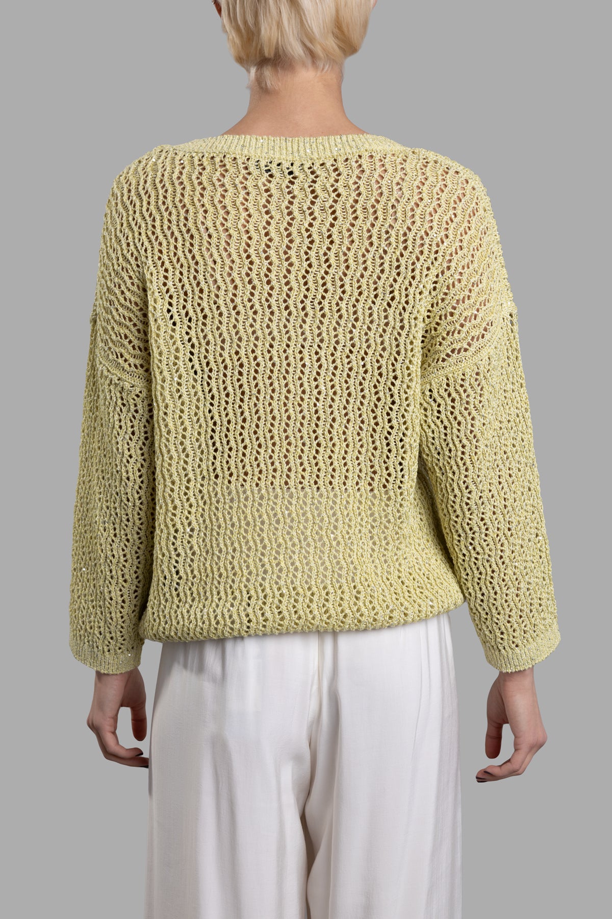 Gentry Portofino Lime Sweater, showcasing a relaxed fit with dropped shoulders and an open knit texture from the back.