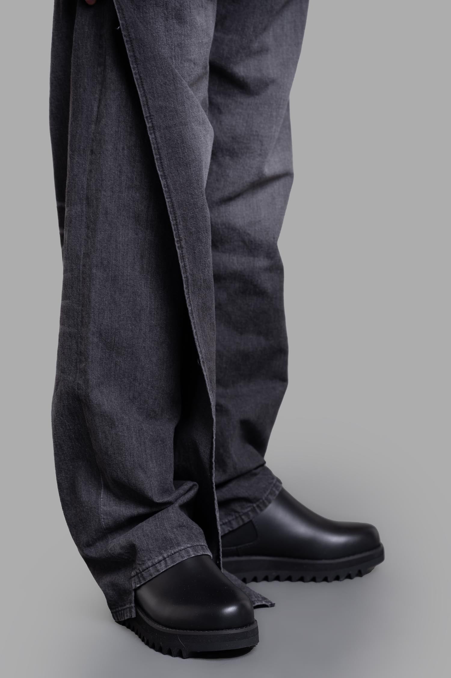 Junya Watanabe x Levi's® Wraparound Jeans worn on model, showcasing a relaxed fit and unique grey denim texture.