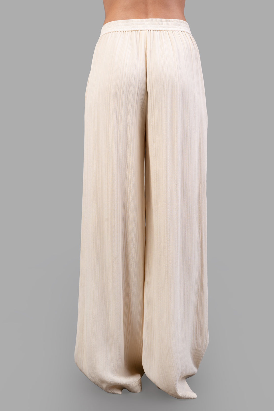 Joseph Mawn Pleat Jacquard Trousers shown from the back, featuring a relaxed wide-leg design in lightweight viscose fabric.