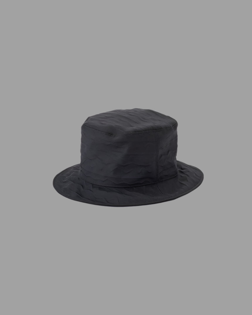 Kijima Takayuki Textured Bucket Hat in black, showing side view. Crafted from polyester and cotton for classic elegance.