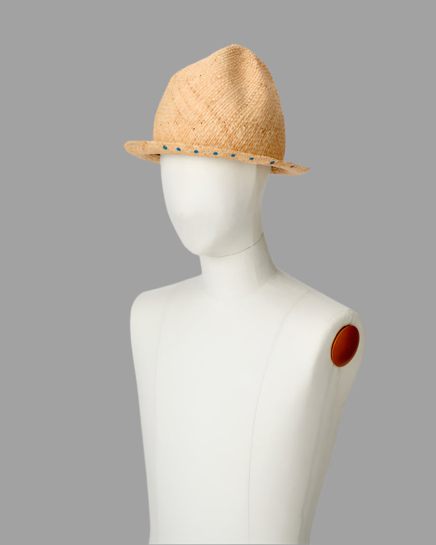 Kijima Takayuki Straw Buffalo Hat displayed from the side on a mannequin, showcasing its handcrafted beige raffia texture.