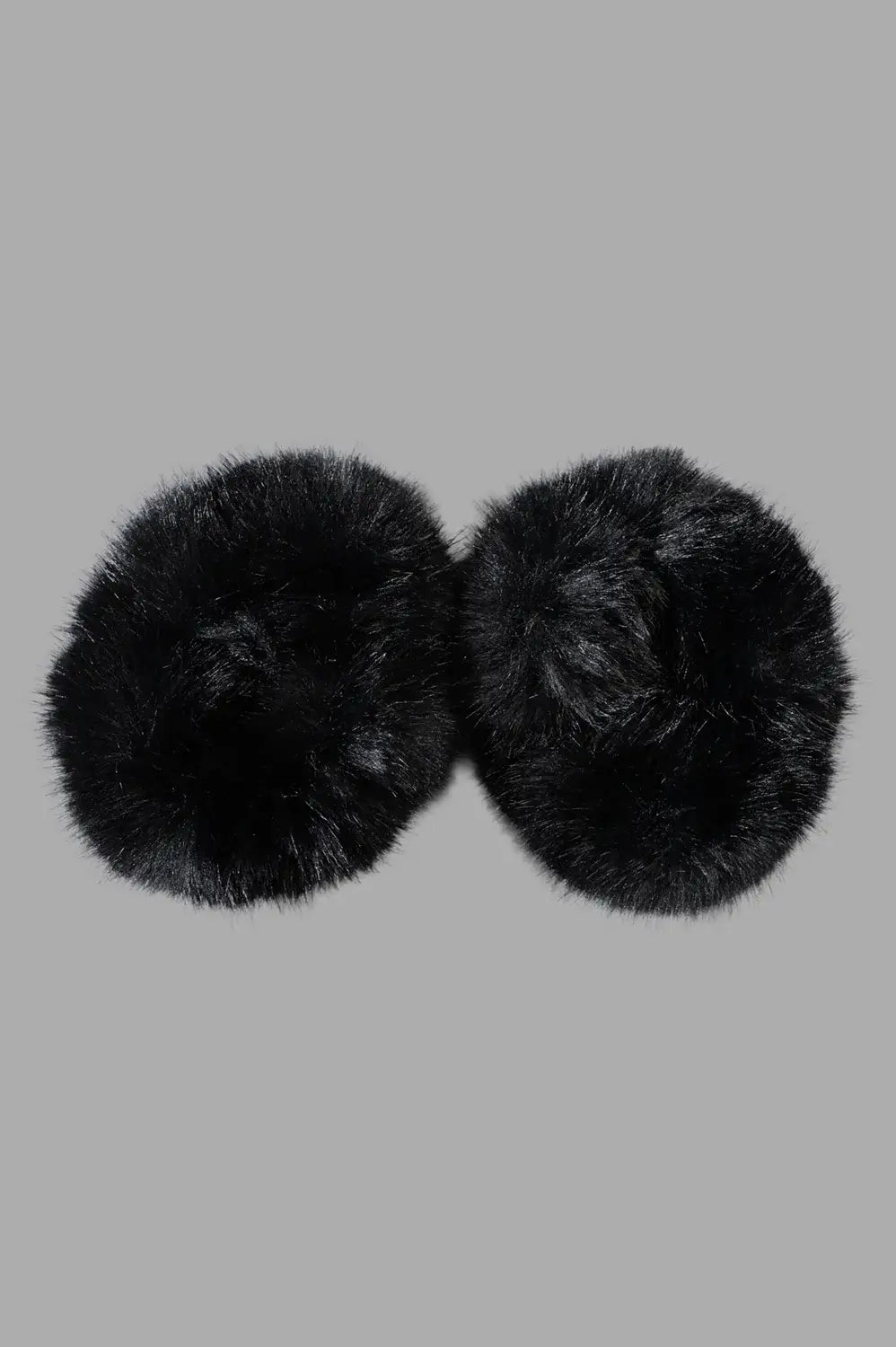 By Malene Birger Elbie Wrist Cuffs, black faux fur, fluffy texture, close-up detail, polished finish.