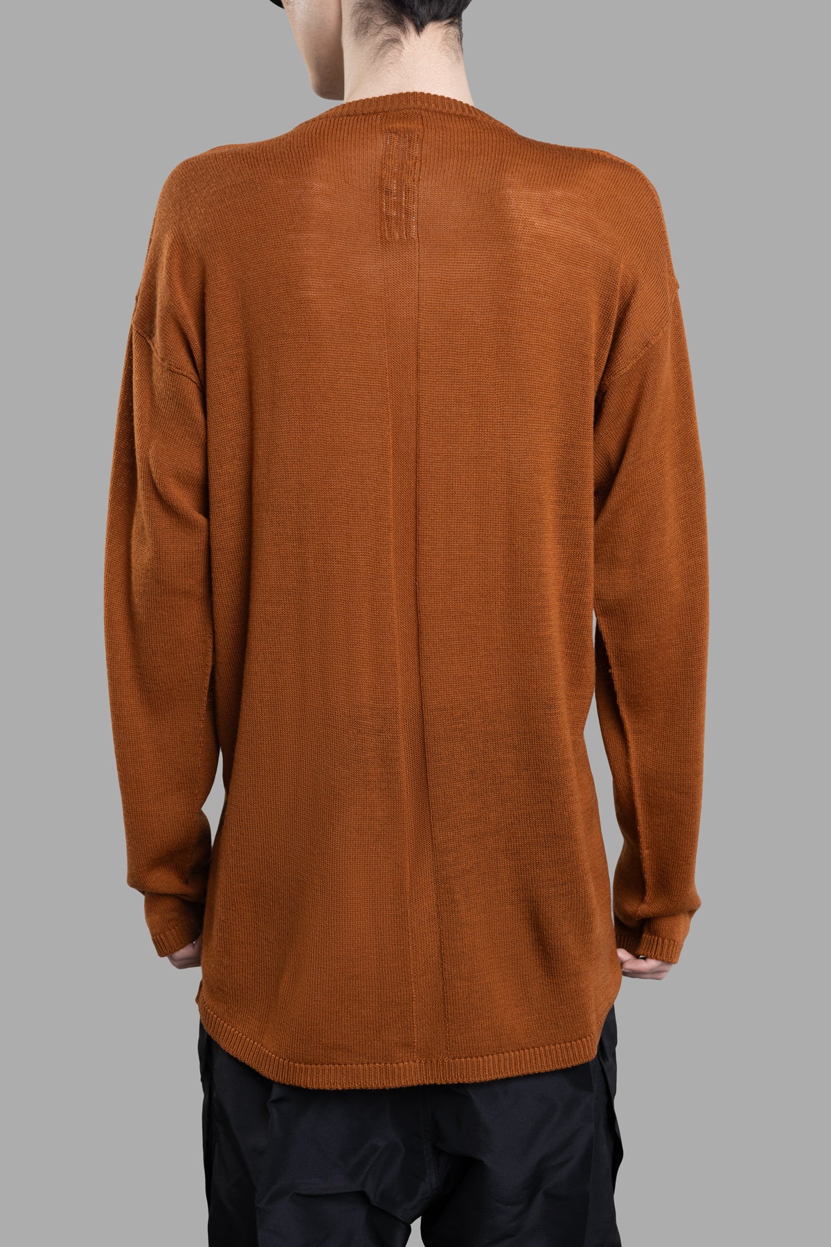 Rick Owens Oversized Sweater in clay, showcasing back view with long sleeves, dropped armholes, and knit jacquard pattern.