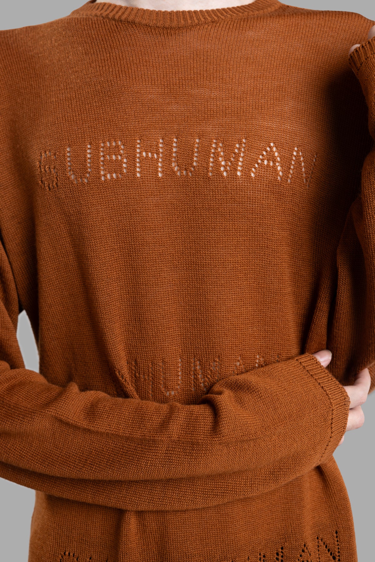 Rick Owens Oversized Sweater in clay, featuring a knit jacquard pattern, below-hip length, long sleeves, and round neck.