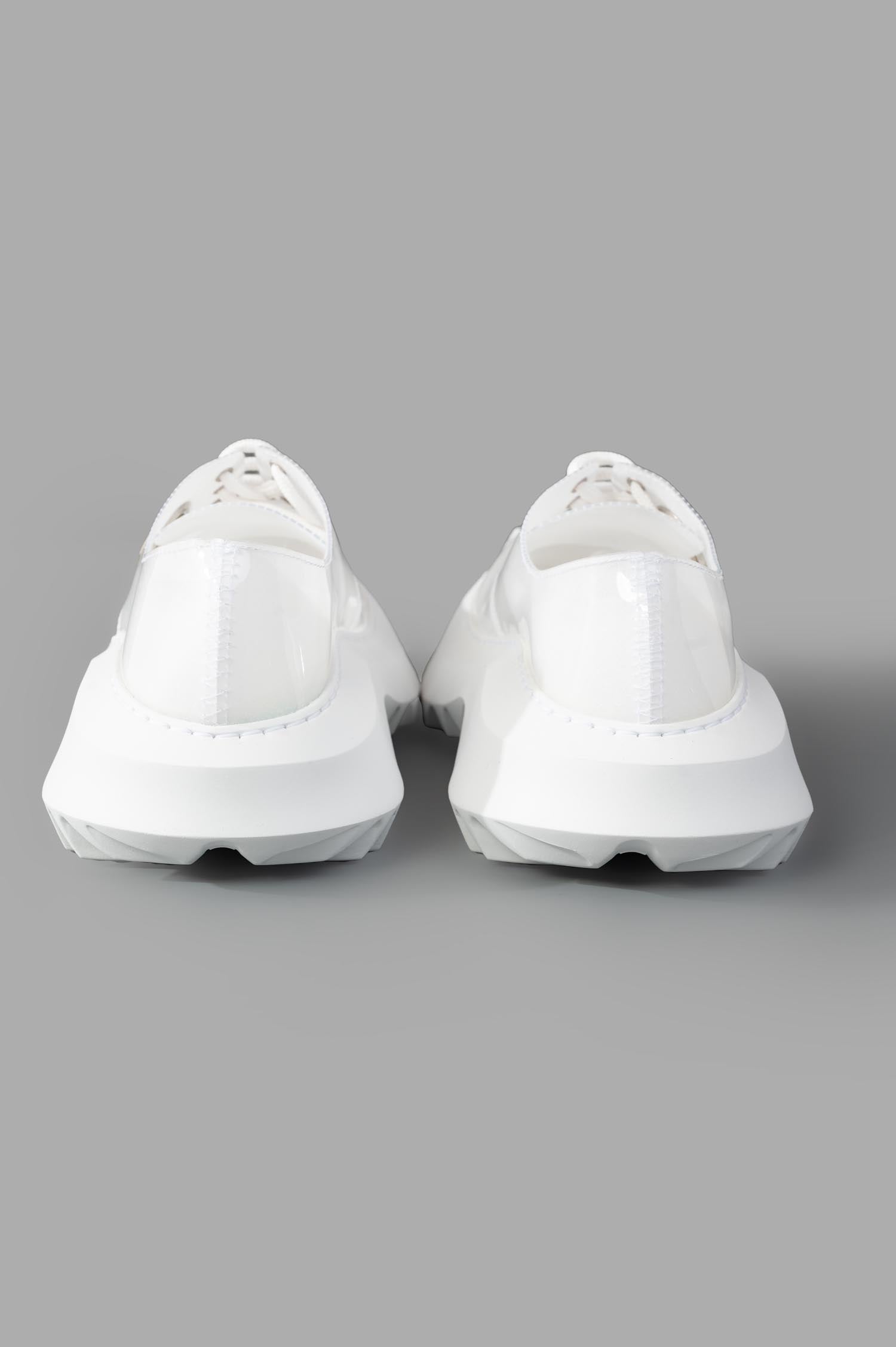 Comme des Garçons x Phileo 062 Derby Shoes, back view showcasing sleek white rubber design and unique textured sole.