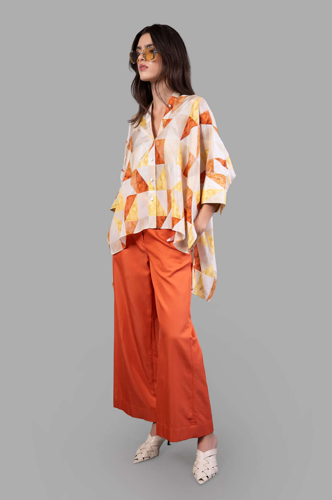 Joseph Arcole Marble-print Silk Shirt, front view on model, geometric pattern with orange wide-leg pants.