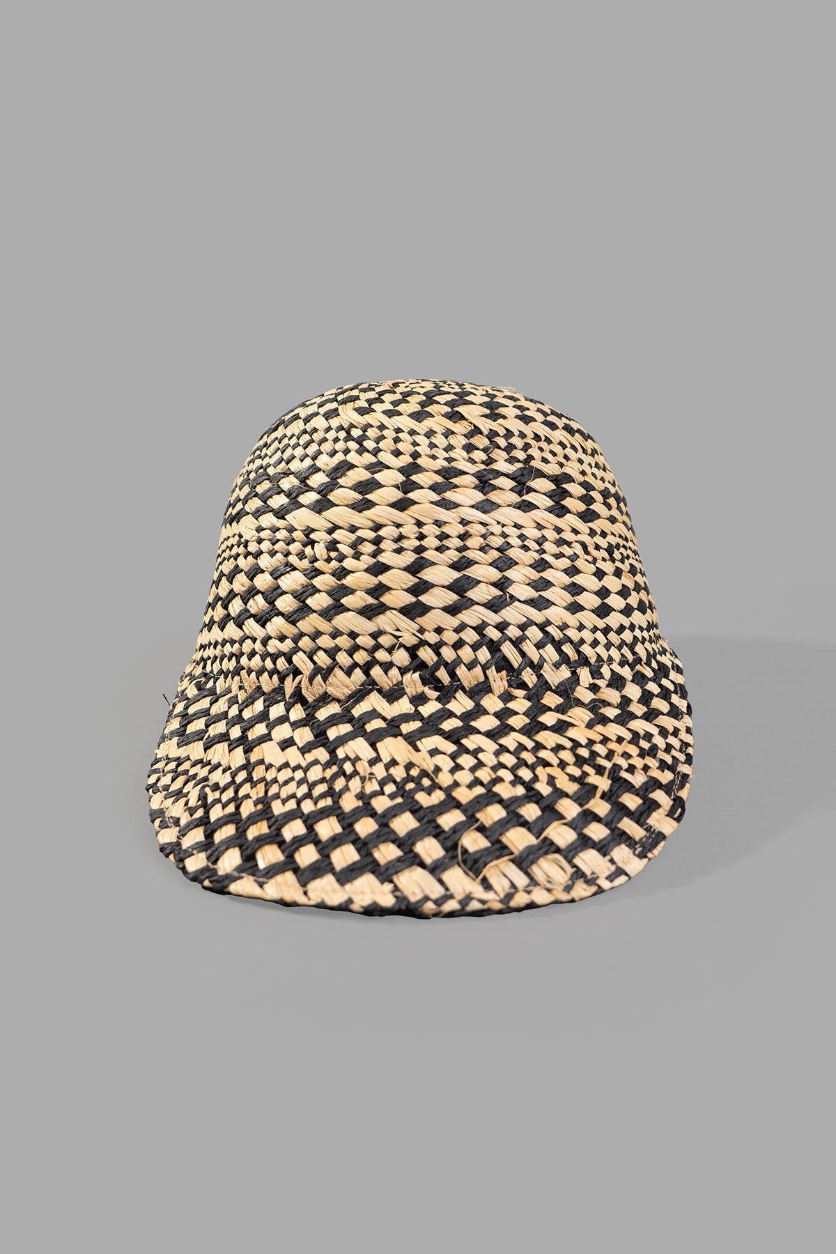 Kijima Takayuki Straw Baseball Cap in black and beige, showcasing a textured raffia weave from the front angle.