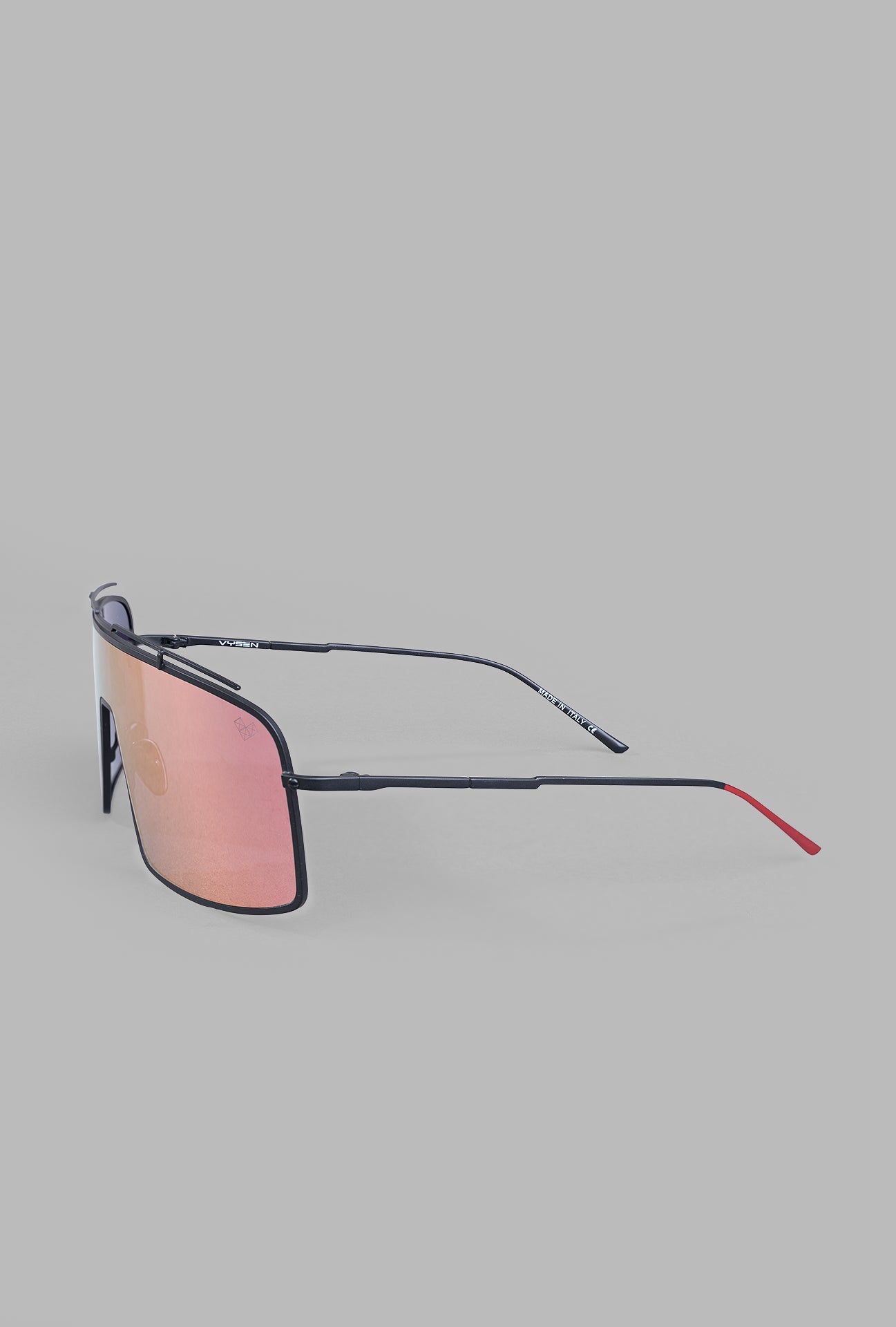 Vysen Eyewear. The Dorian - DR4 sunglasses showcasing a black matte frame and rose gold mirror lenses in profile view.